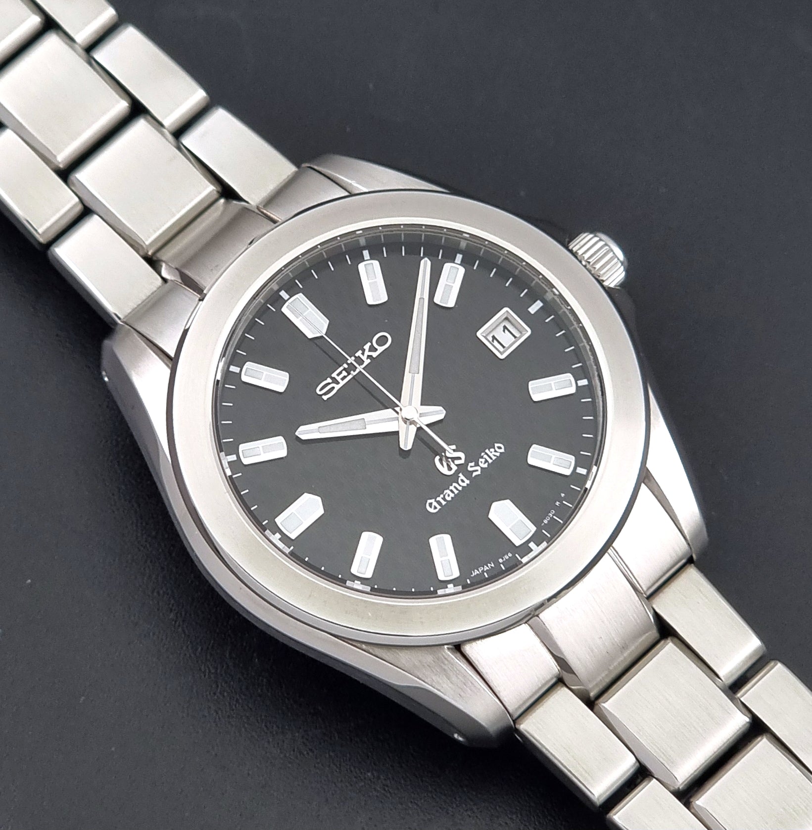 Grand Seiko SBGF021 quartz watch 8J56-8020 a close up of the watch sat on a dark background