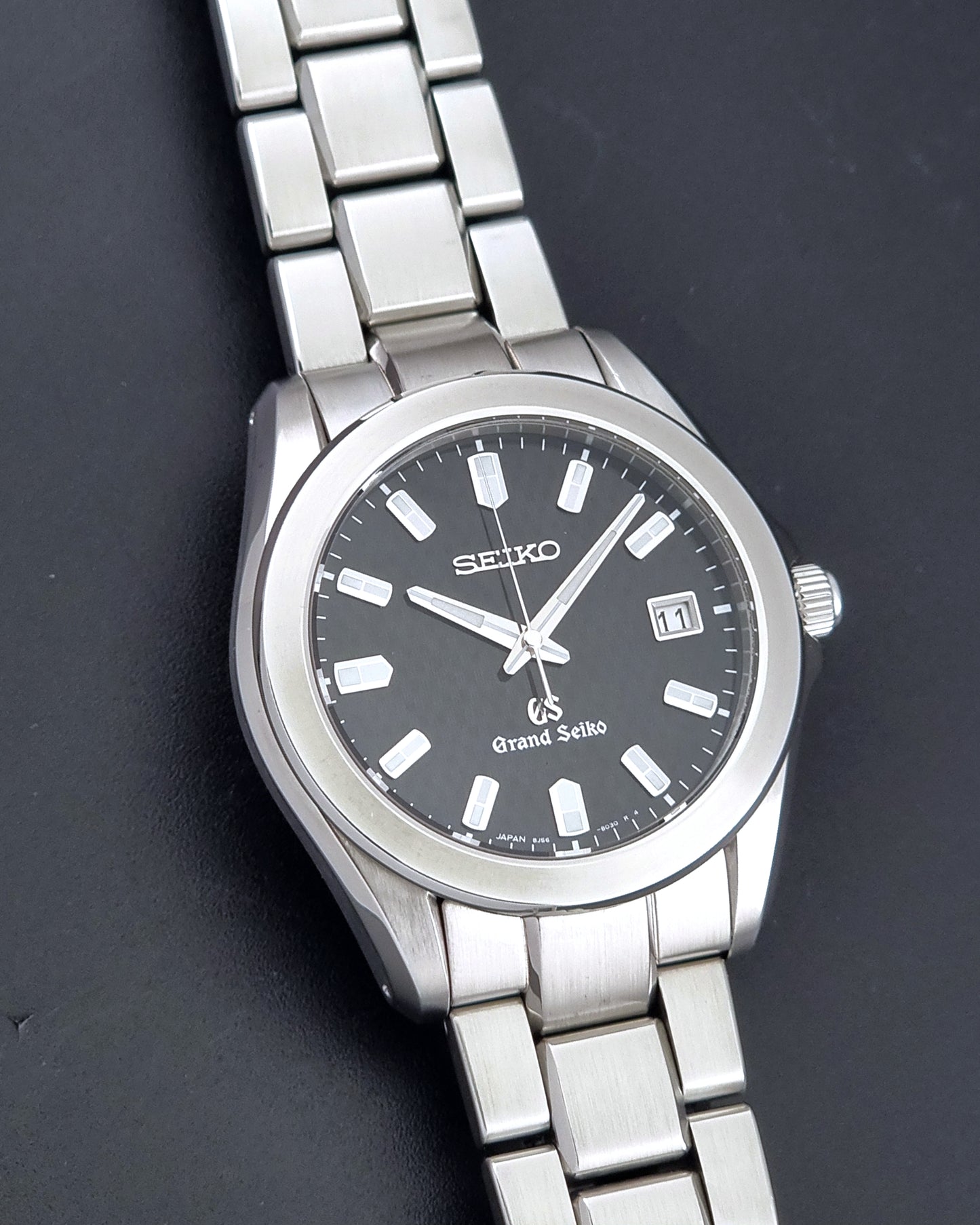 Grand Seiko SBGF021 quartz watch 8J56-8020 front view on a dark background