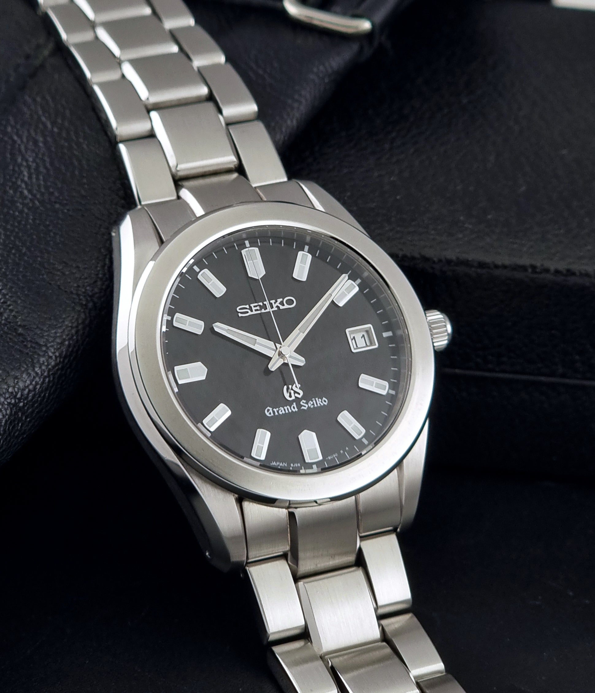 Grand Seiko SBGF021 quartz watch 8J56-8020 resting on a dark background