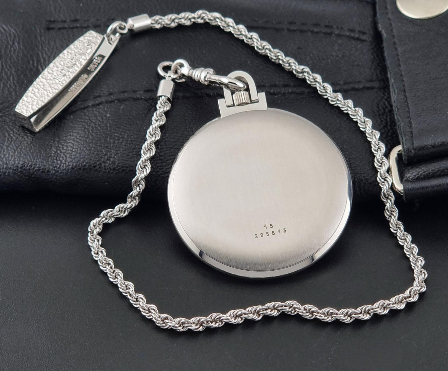 A vintage Longines pocket watch 7713 showing the case back case back