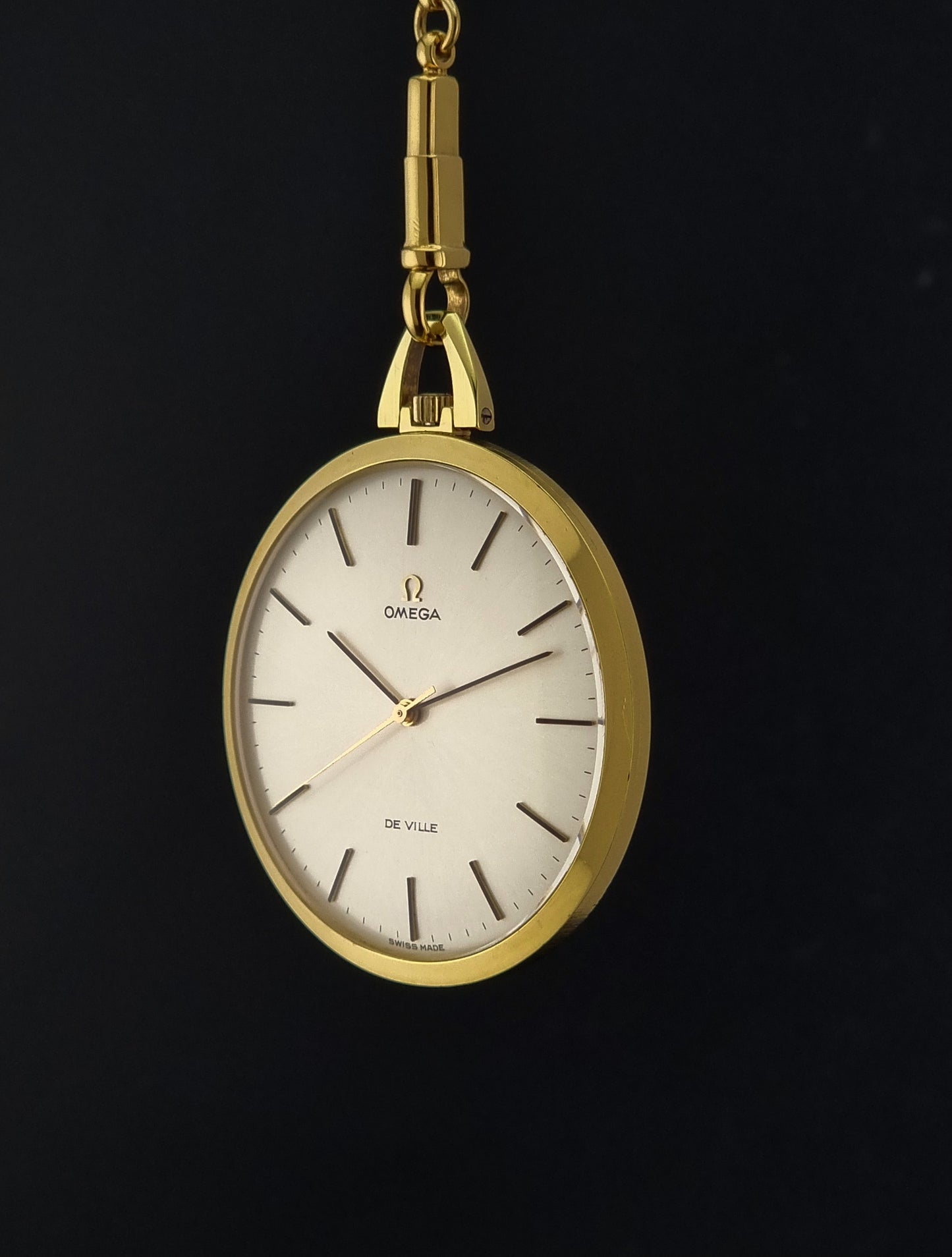 Vintage Omega De Ville Pocket Watch 1714 side profile on a dark background