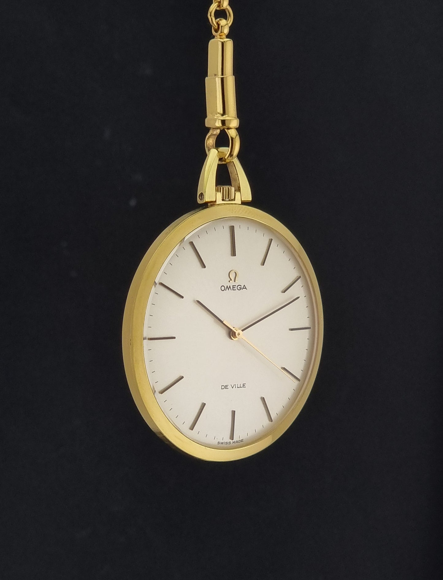 Vintage Omega De Ville Pocket Watch 1714 side profile on a dark background