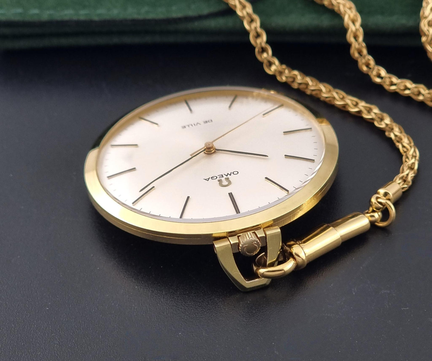 Vintage Omega De Ville Pocket Watch 1714 crown view on a dark background