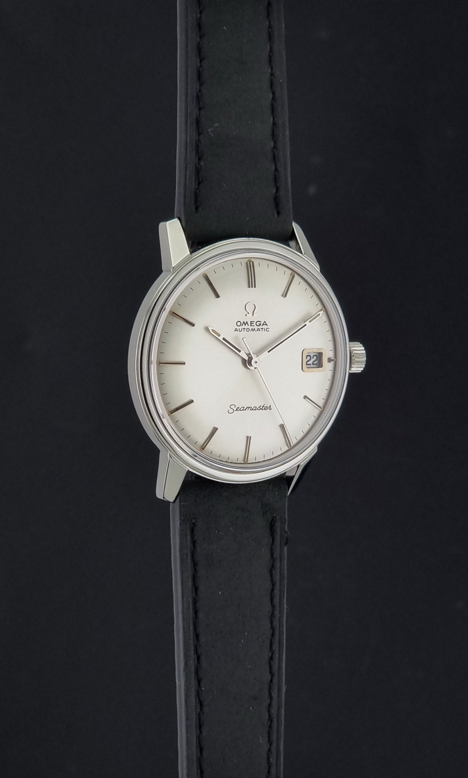 A Vintage Omega Seamaster watch 166.037 wristwatch on a dark background