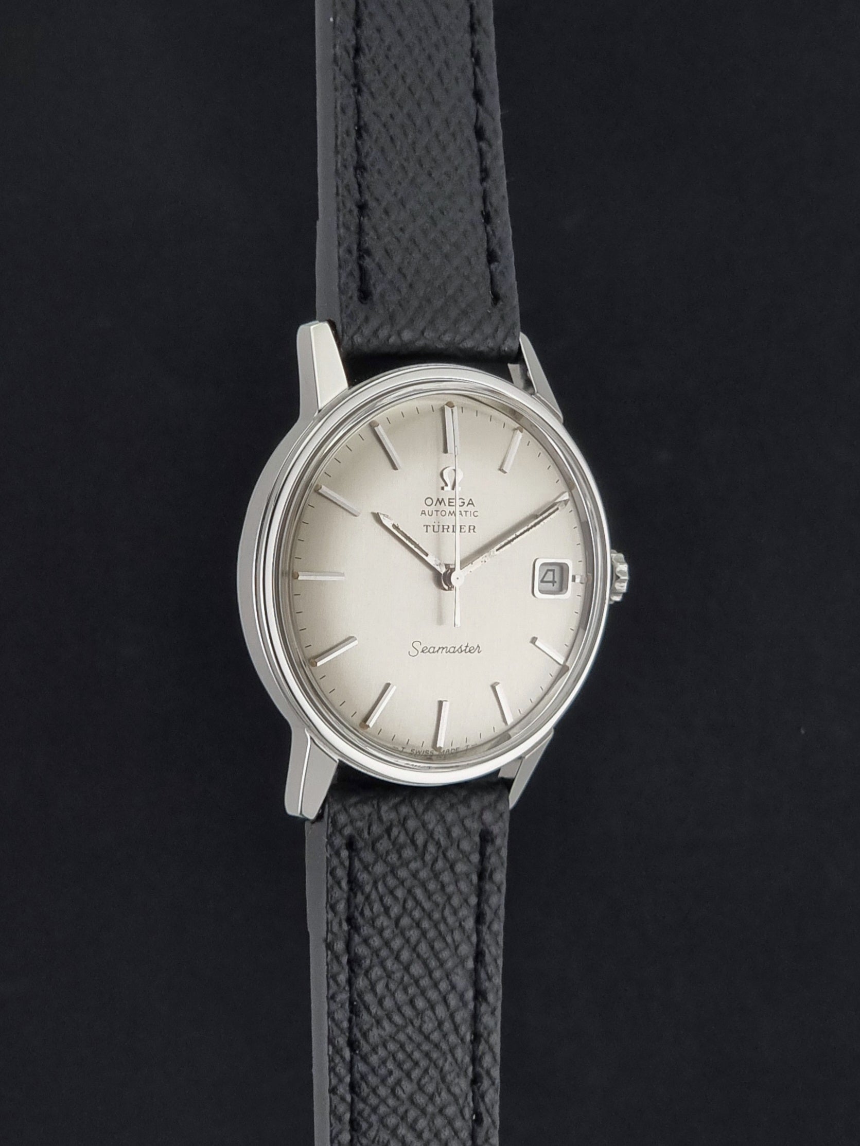 A Vintage Omega Seamaster Wristwatch 166.002 Turler dial on a dark background side profile