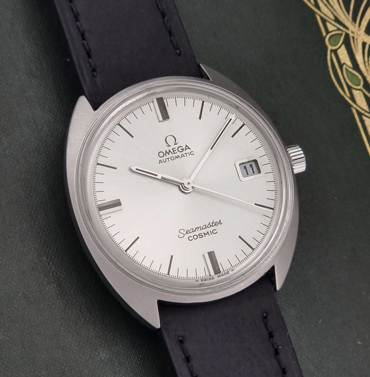Vintage Omega Seamaster Cosmic 166.026 silver sunburst dial – dial and case front view