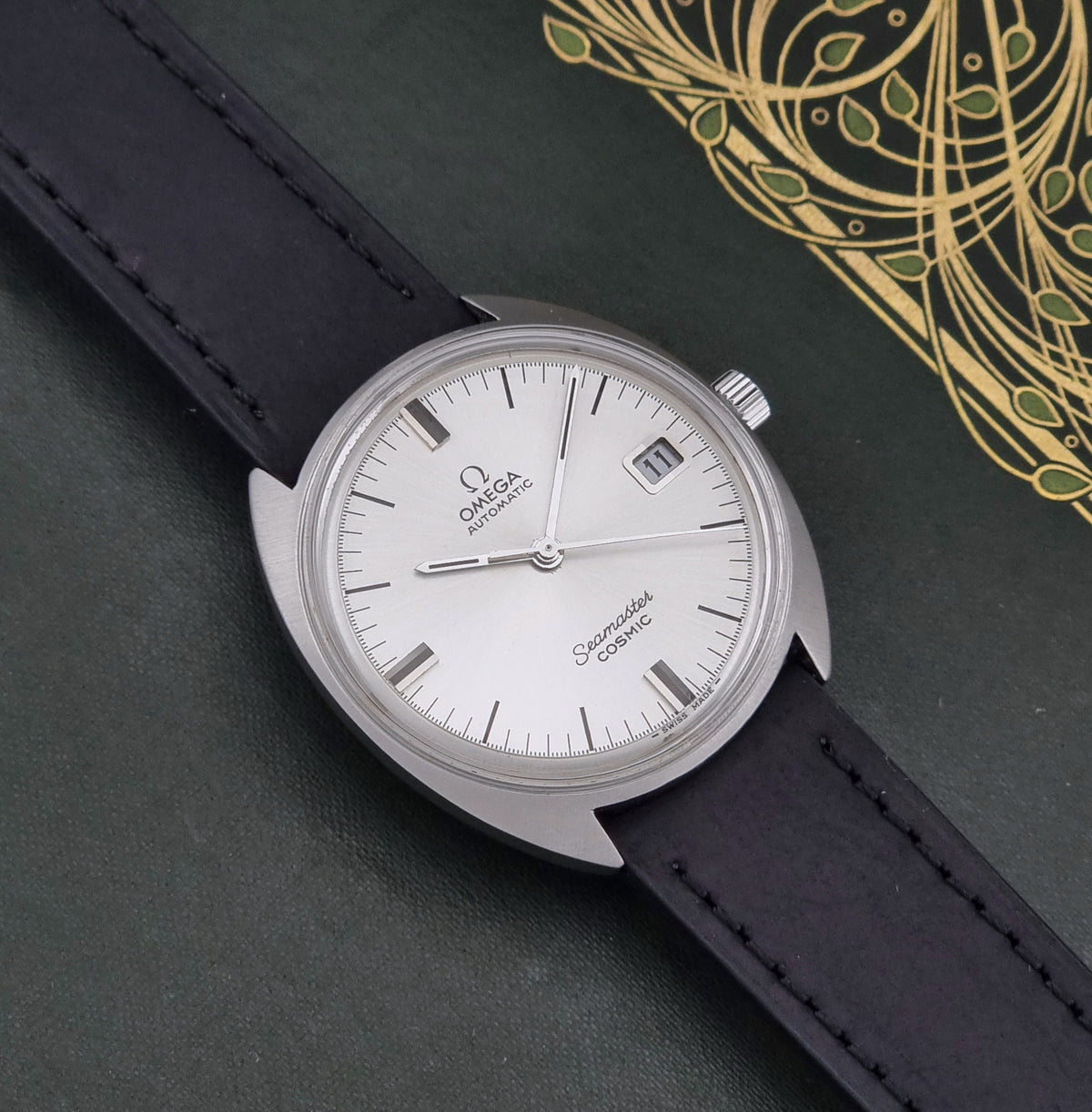 Vintage Omega Seamaster Cosmic 166.026 silver sunburst dial – dial and case front view