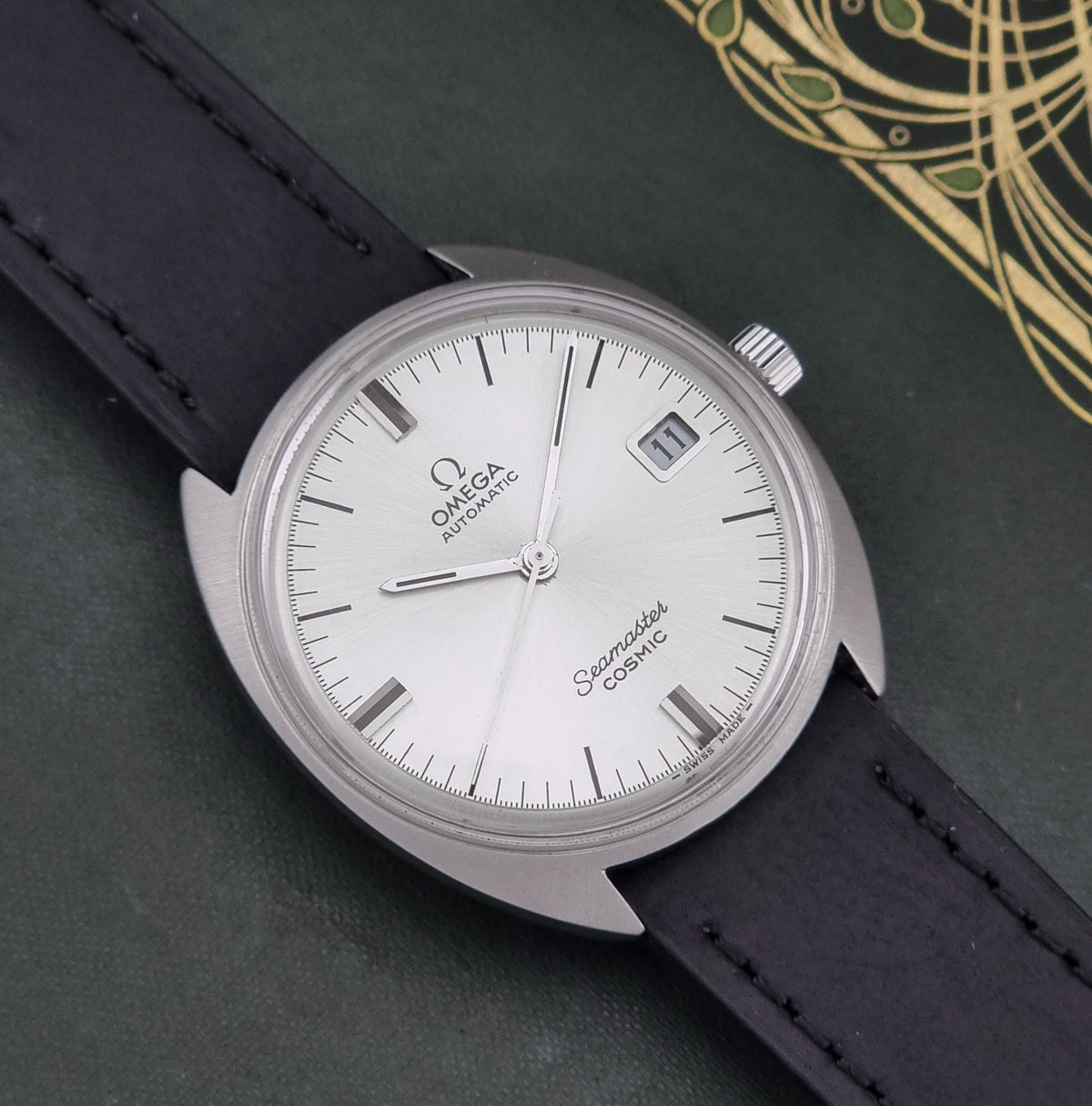 Vintage Omega Seamaster Cosmic 166.026 silver sunburst dial – dial and case front view