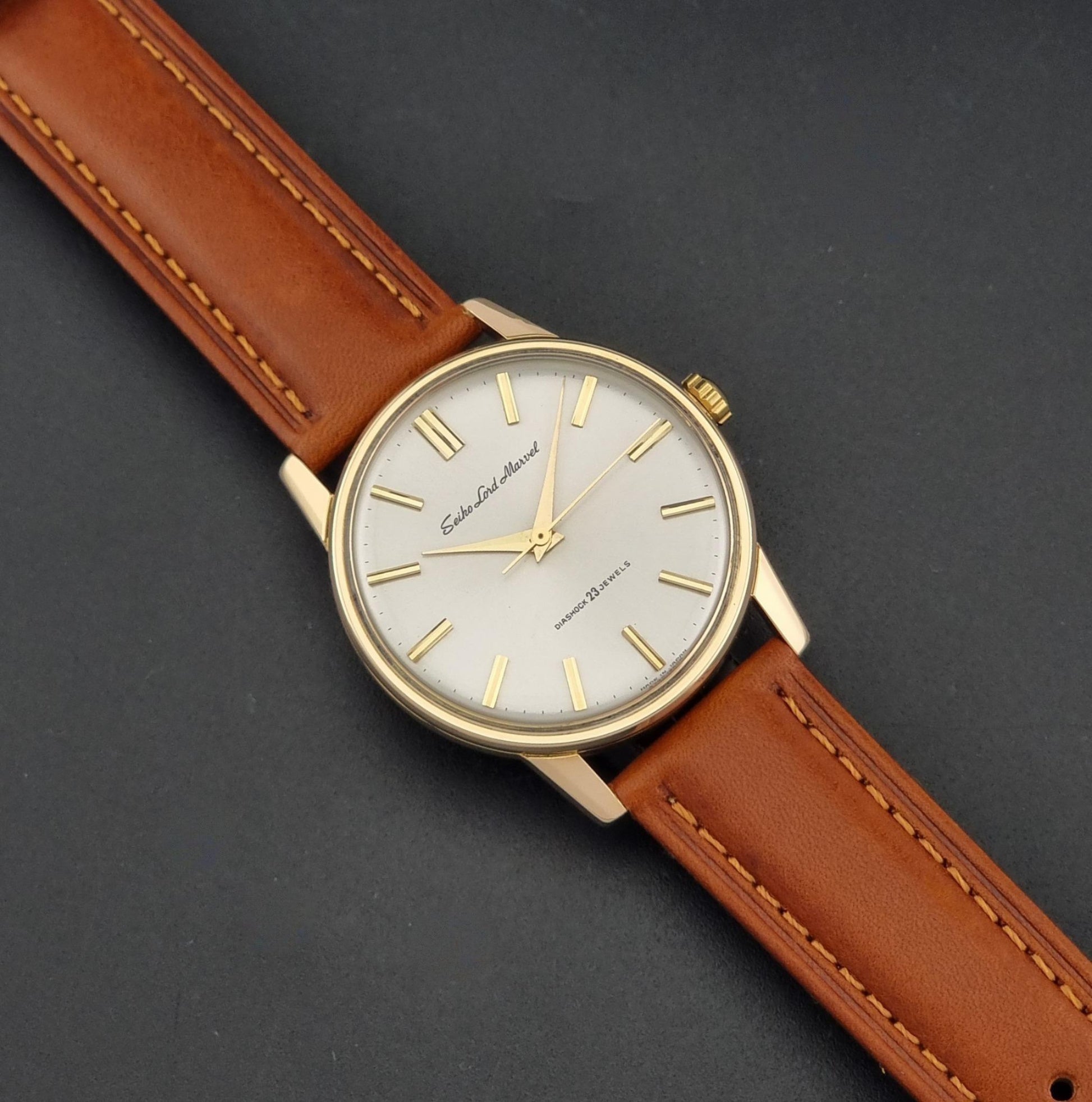 Vintage Seiko Lord Marvel 5740-1990 Wristwatch on a dark background angled view