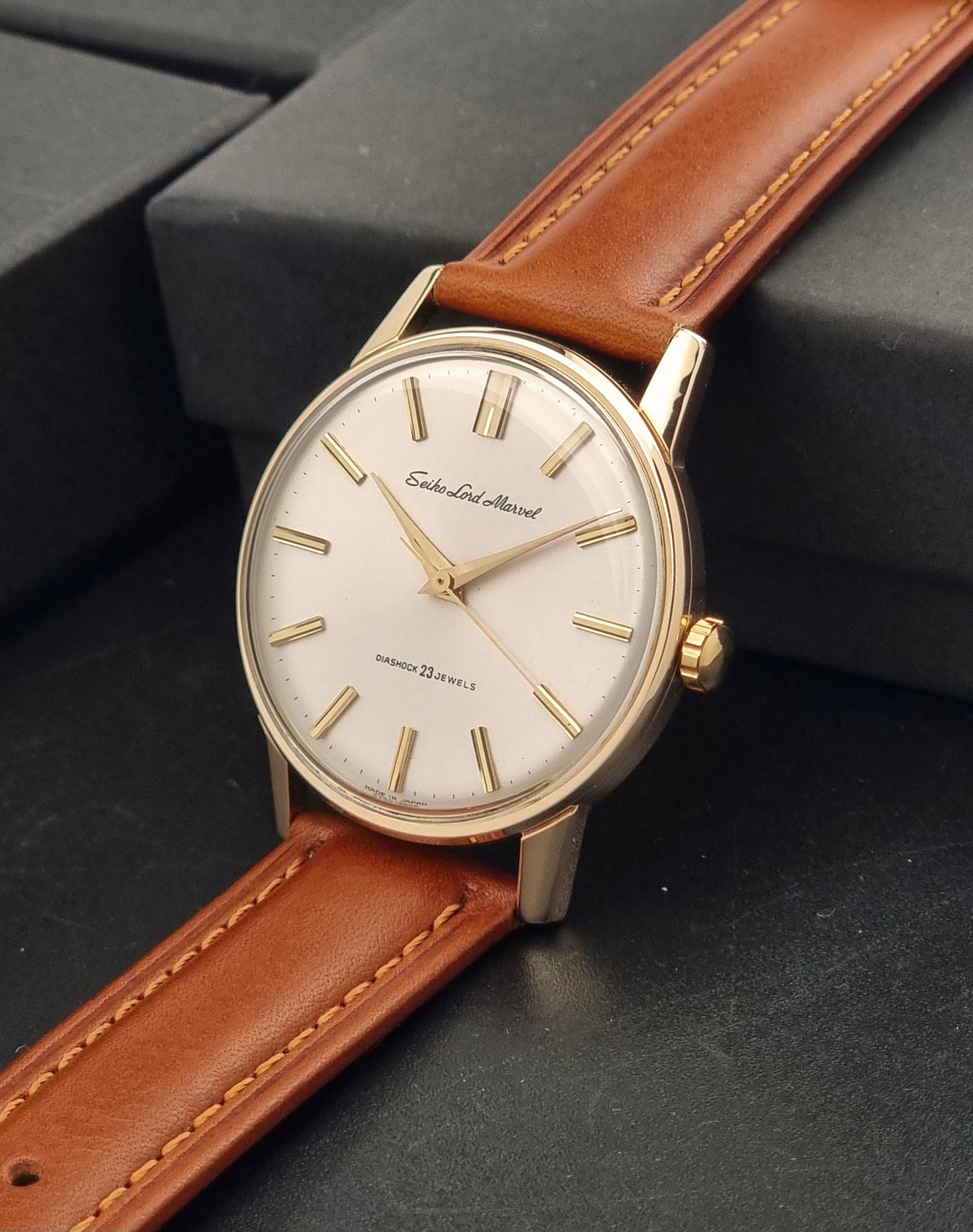 Vintage Seiko Lord Marvel 5740-1990 Wristwatch on a dark background crown side view