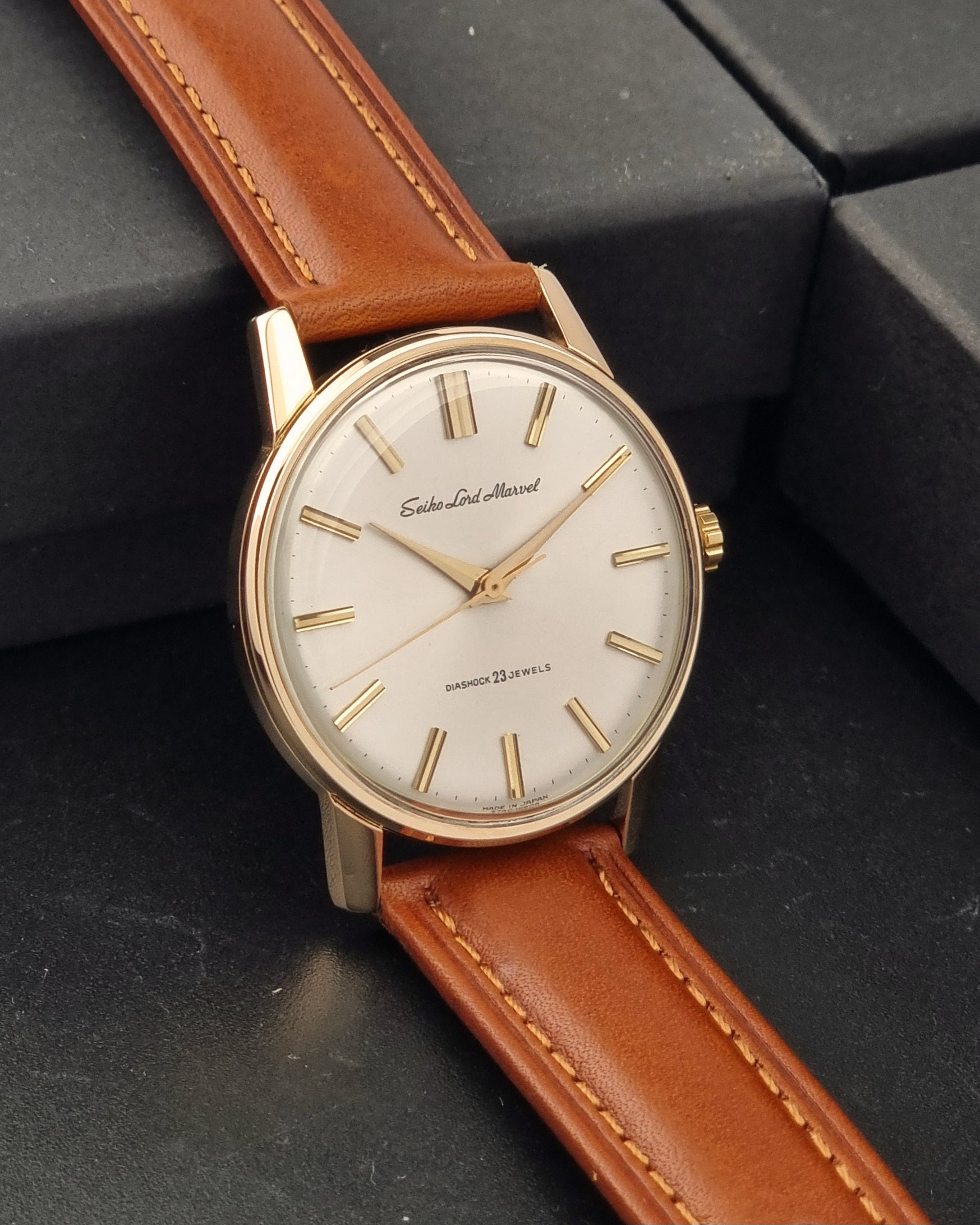 Vintage Seiko Lord Marvel 5740-1990 Wristwatch on a dark background side view