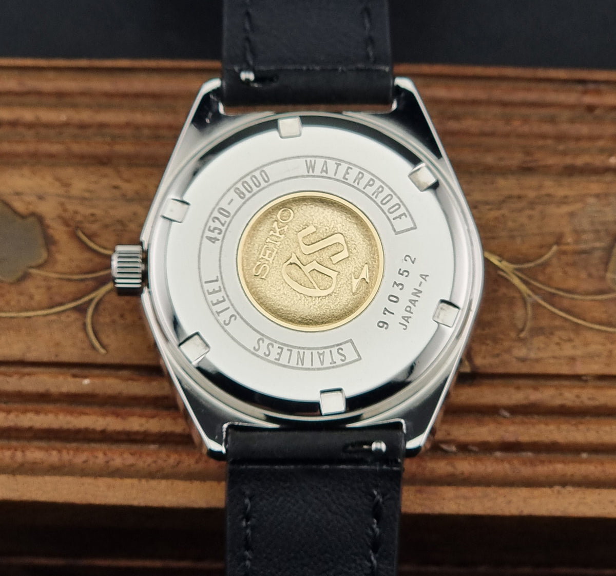 1969 vintage Grand Seiko 4520-8000 Hi-Beat watch; caseback view showing the rear case and visible markings