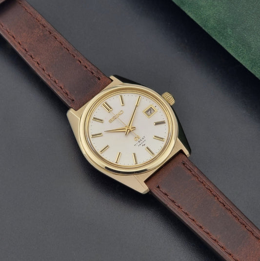 Vintage Grand Seiko watch 4522-8000  a brown leather strap on a dark background dial