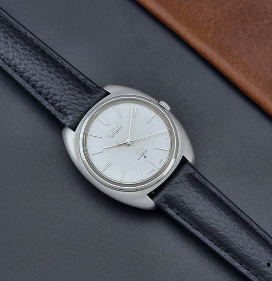 Vintage Grand Seiko Wristwatch 5641-7000 with a black leather strap on a dark background dial