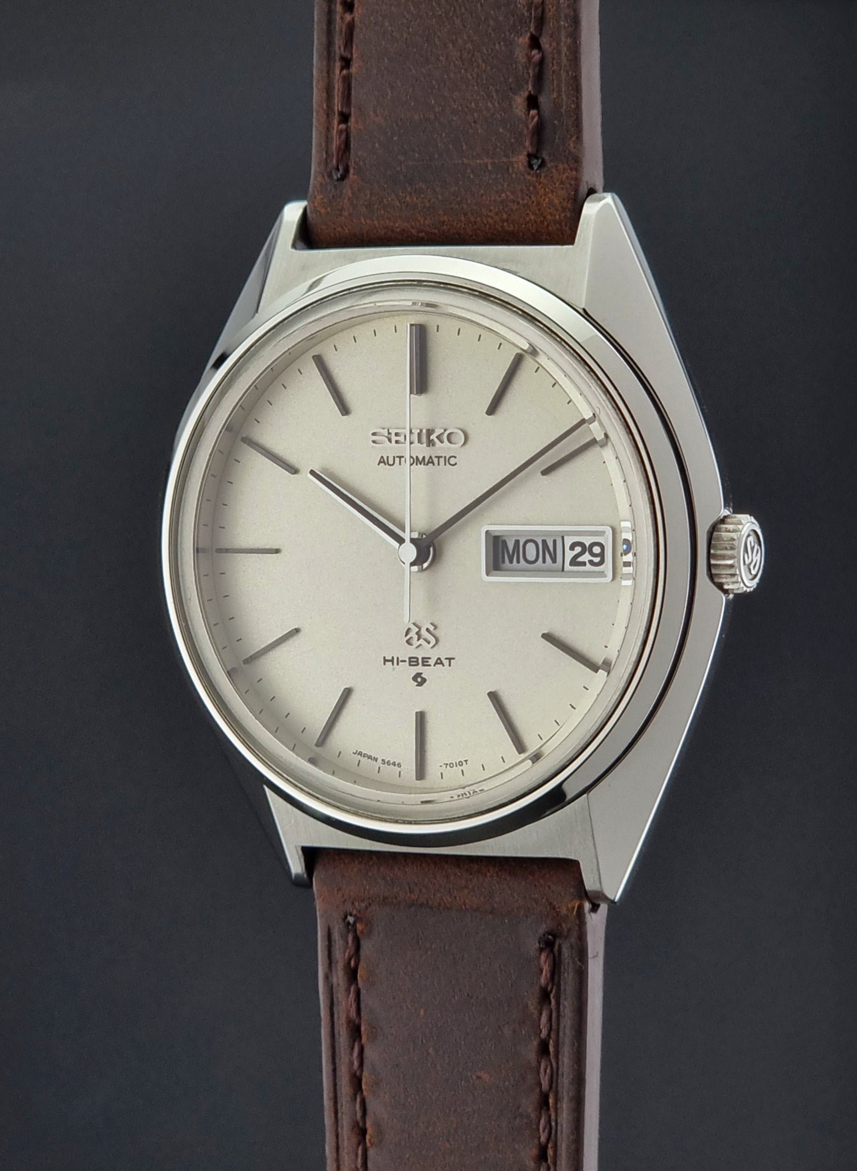 Vintage Grand Seiko Watch with brown leather strap on a dark background