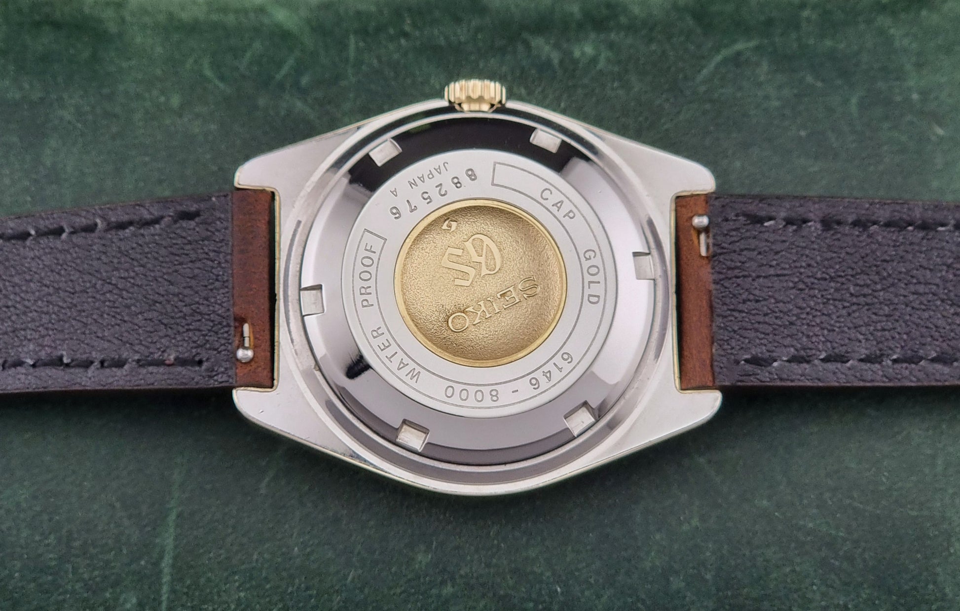 Vintage Grand Seiko watch 6146-8000 in gold with a brown leather strap case back