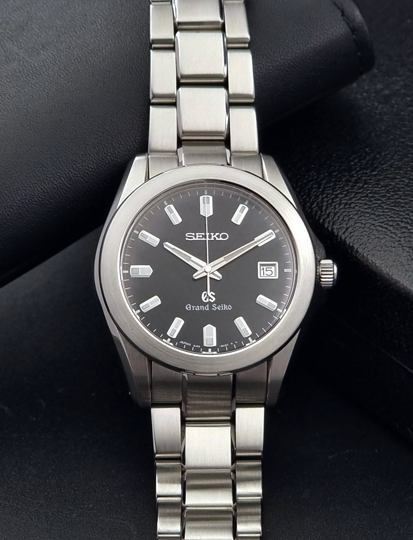 Grand Seiko SBGF021 quartz 8J56-8020 watch with a dark face on a dark background close dial view