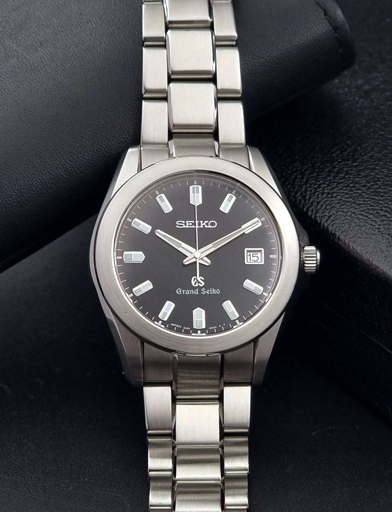 Grand Seiko SBGF021 quartz 8J56-8020 watch with a dark face on a dark background close dial view