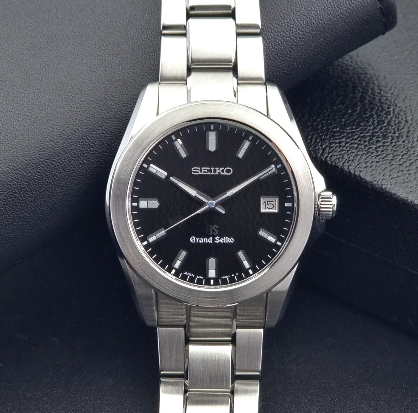 Grand Seiko SBGF021 quartz 8J56-8020 watch with a dark face on a dark background close front view