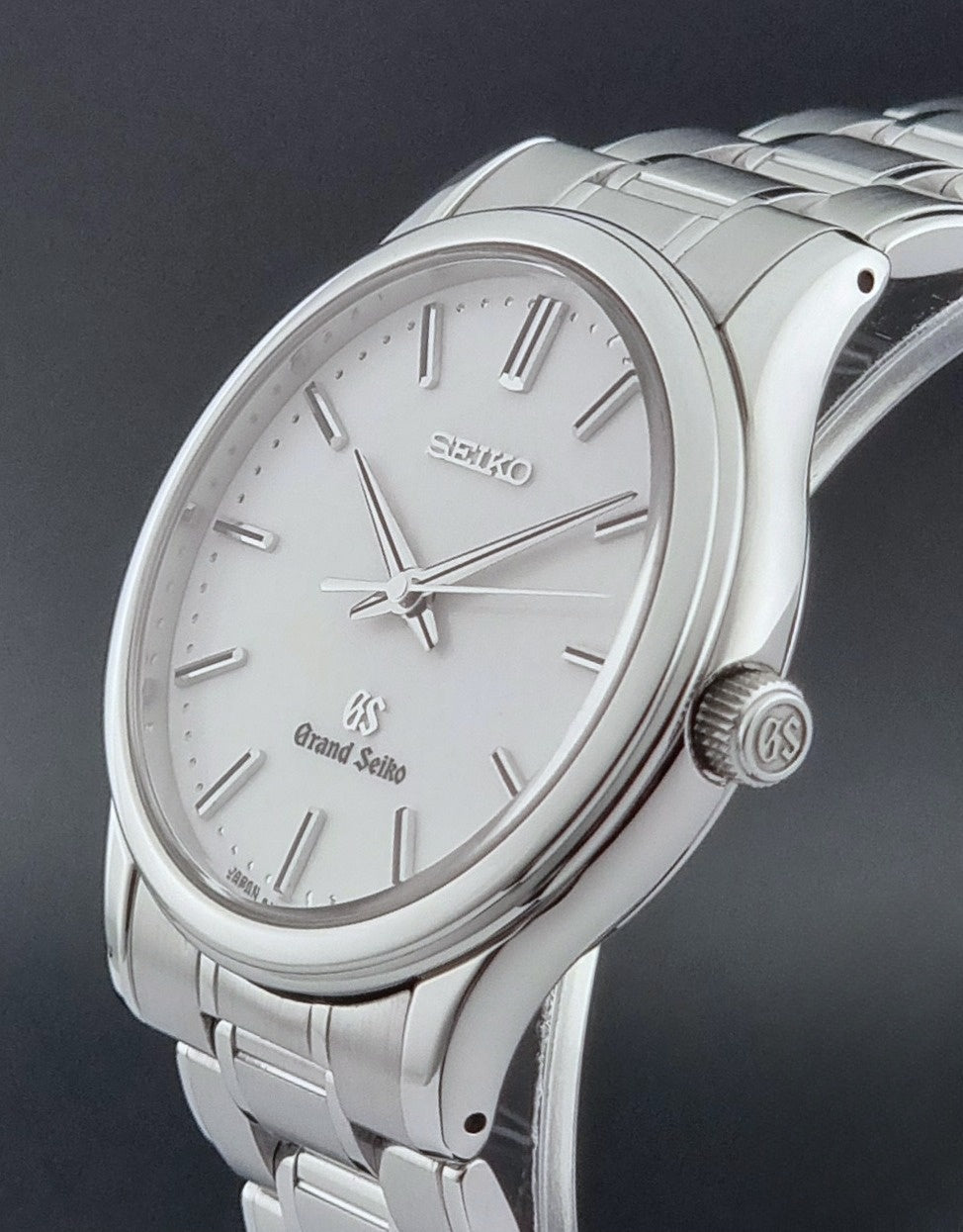Grand Seiko SBGF027 quartz watch 8J55-0AA0 watch on a dark textured background crown profile view