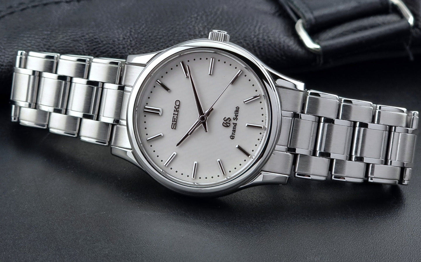 Grand Seiko SBGF027 quartz watch 8J55-0AA0 watch on a dark textured background dial view