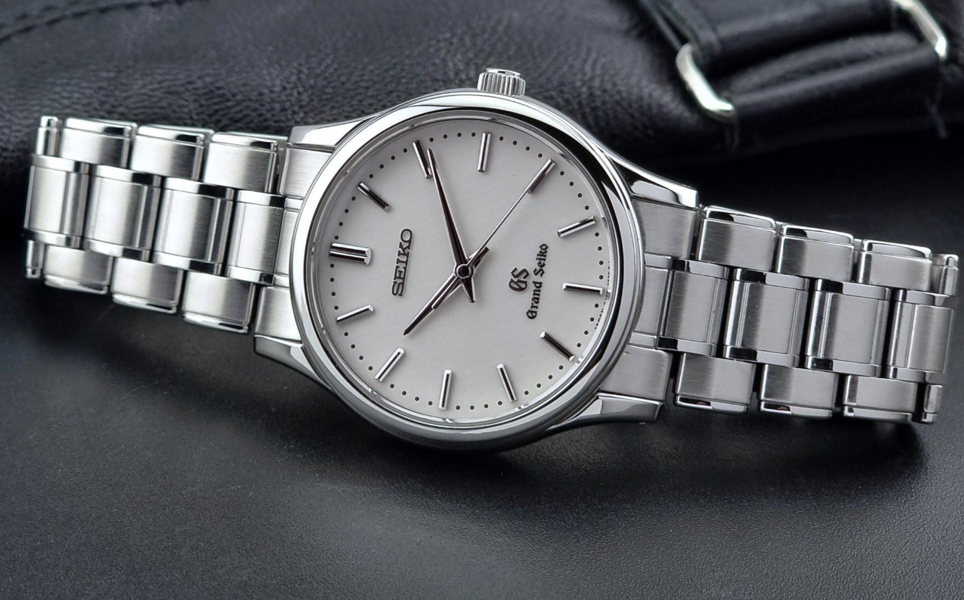 Grand Seiko SBGF027 quartz watch 8J55-0AA0 watch on a dark textured background dial view