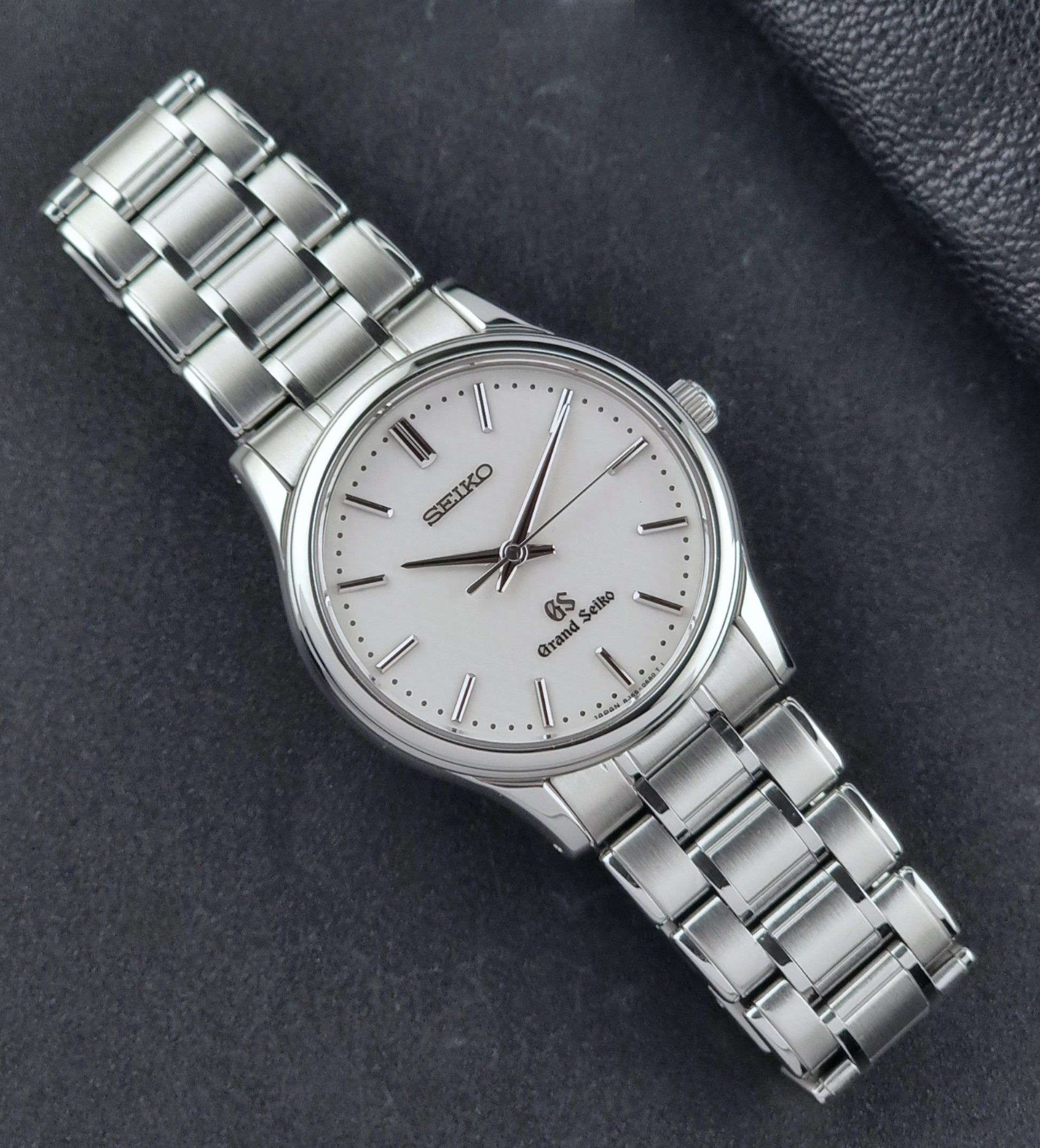 Grand Seiko SBGF027 quartz watch 8J55-0AA0 watch on a dark textured background dial