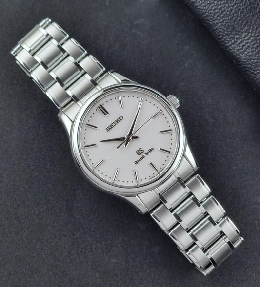 Grand Seiko SBGF027 quartz watch 8J55-0AA0 watch on a dark textured background dial