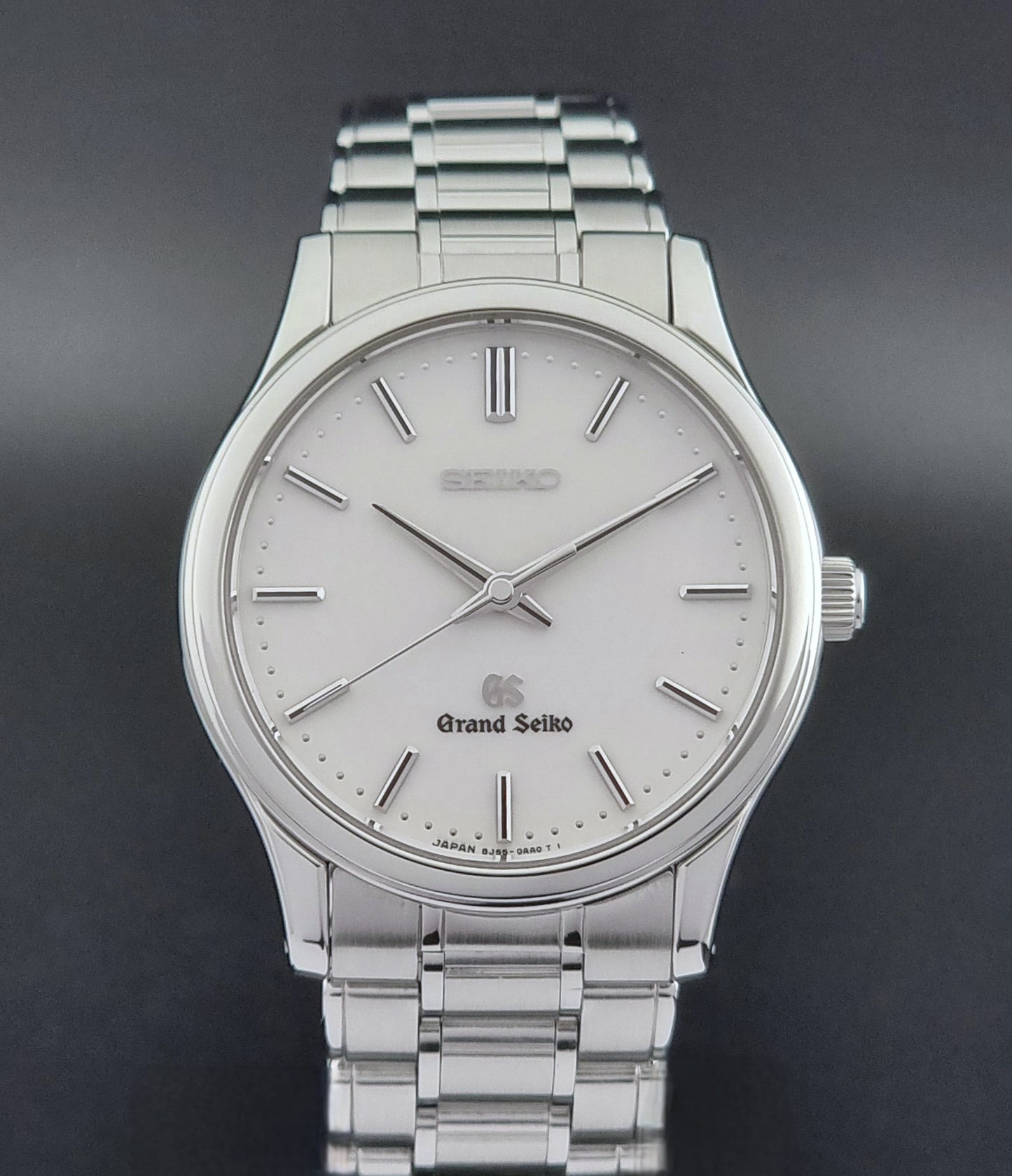Grand Seiko SBGF027 quartz watch 8J55-0AA0 watch on a dark textured background close up dial view