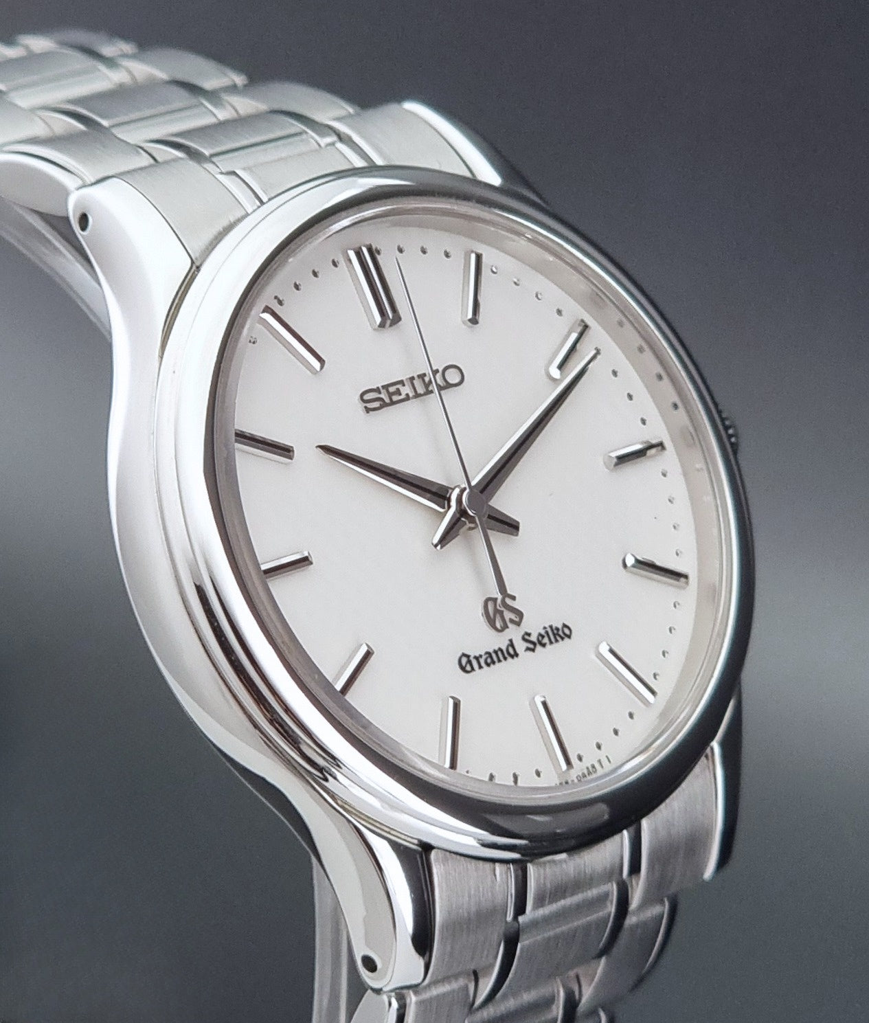 Grand Seiko SBGF027 quartz watch 8J55-0AA0 watch on a dark textured background side profile view