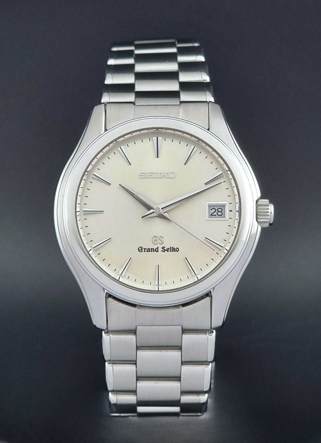 Grand Seiko SBGX005 quartz watch 9F62-0A10 with a detailed face on a dark textured surface close dial view