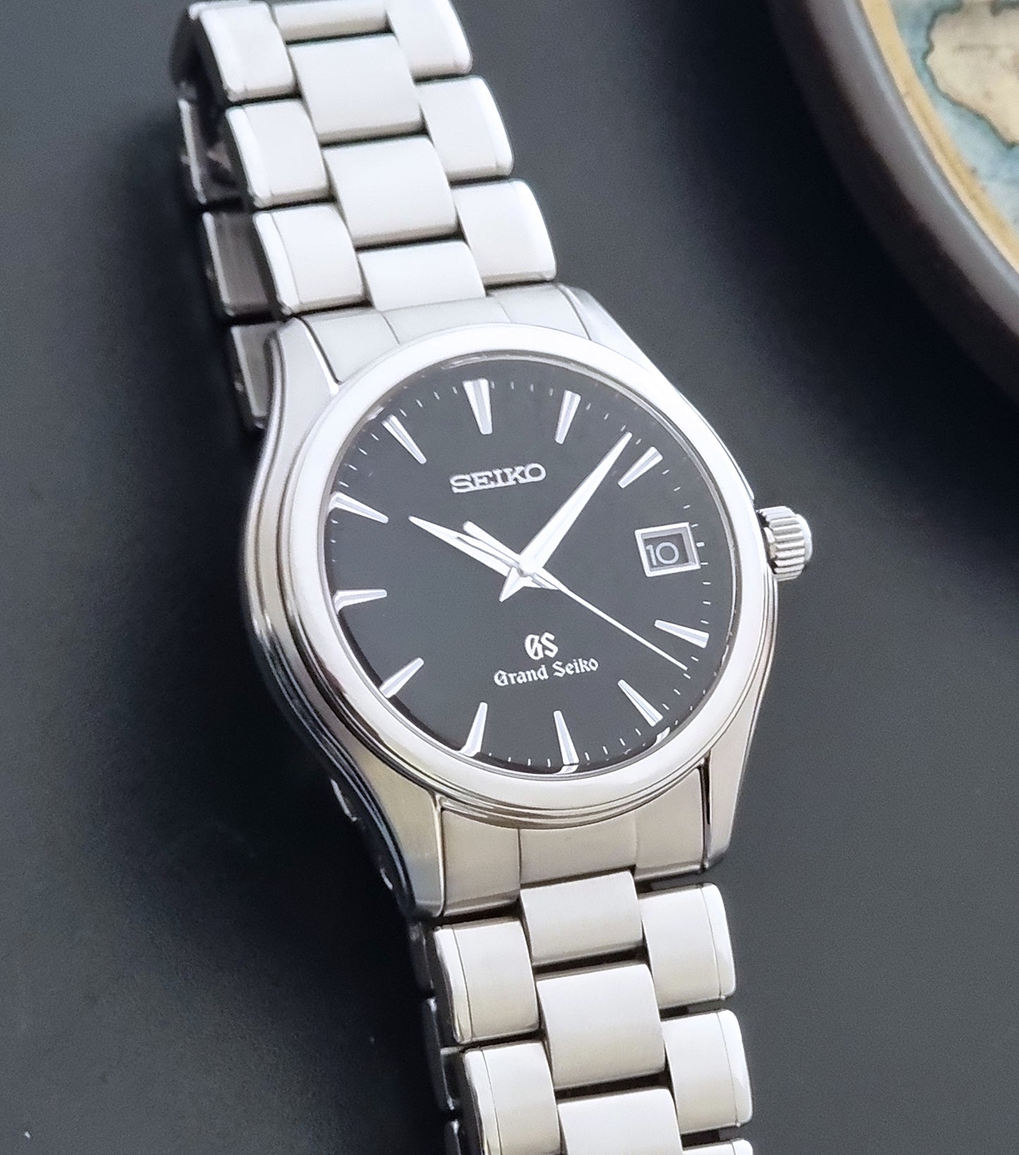 Grand Seiko quartz SBGX041 watch with black dial on a dark background close up of the matt dial