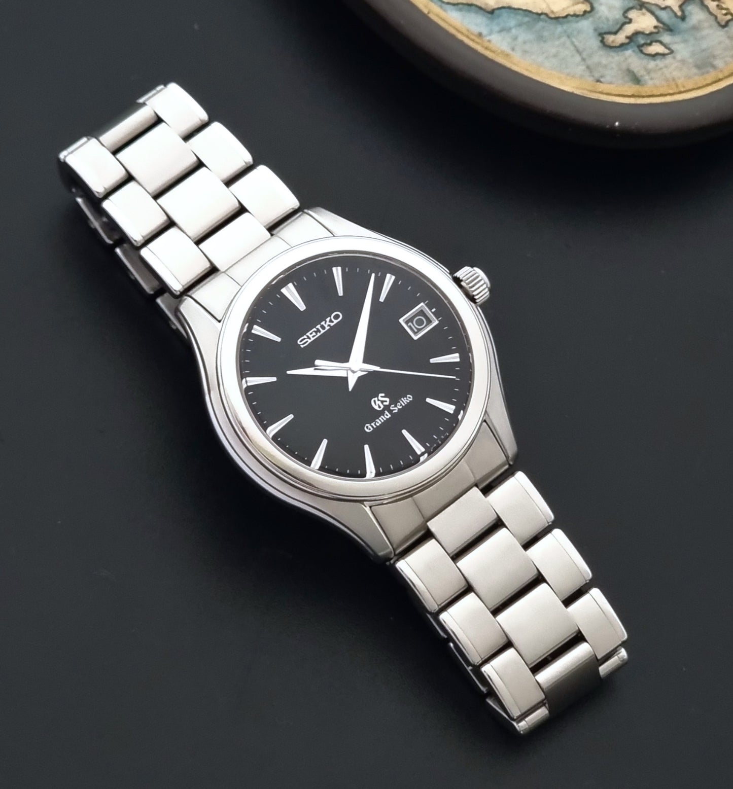 Grand Seiko quartz SBGX041 watch watch with black dial on a dark background
