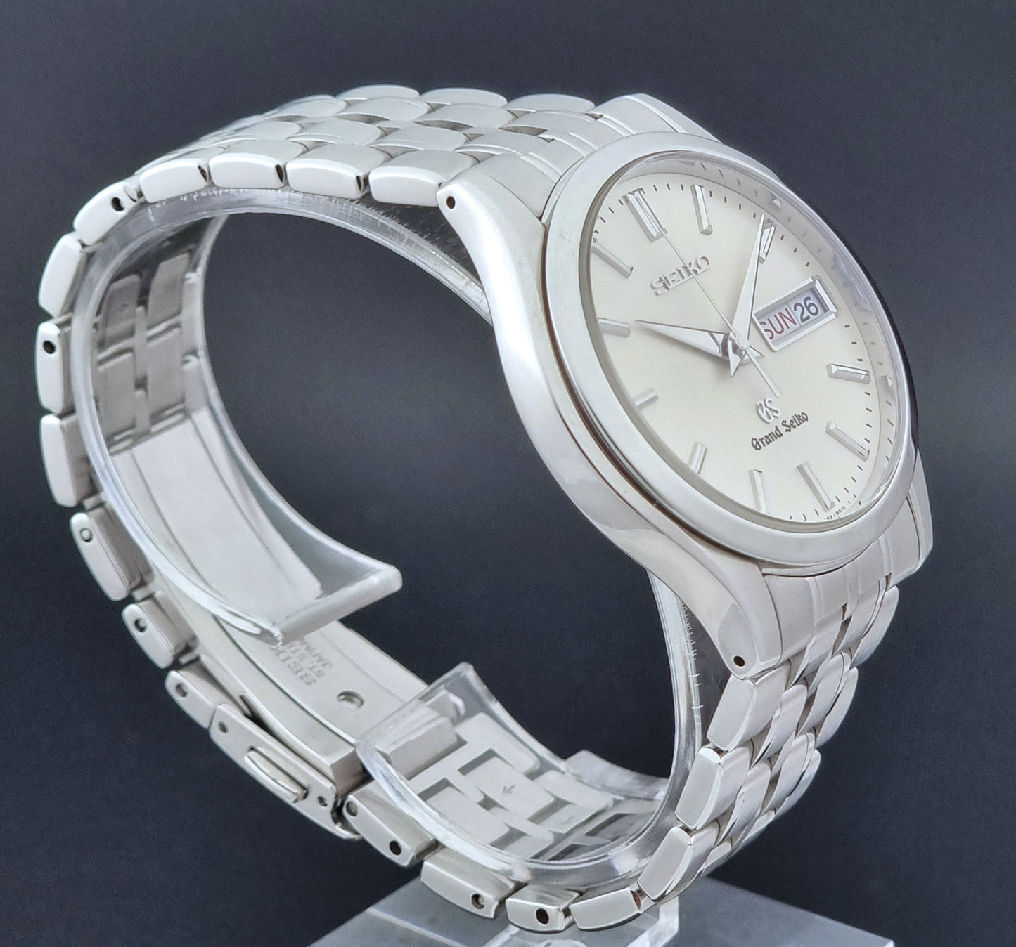 Vintage Grand Seiko SBGT005 quartz watch 9F83-9A30 with bracelet on a dark background full watch view