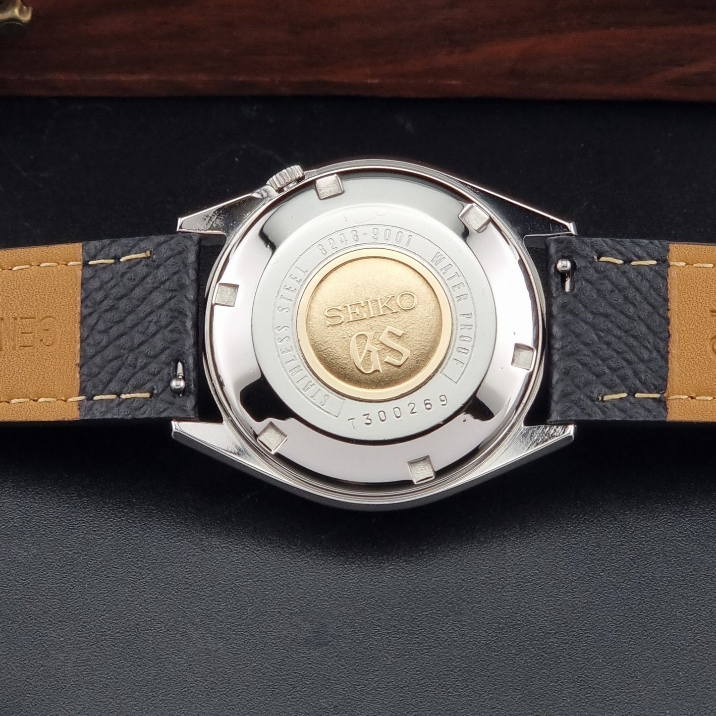 Vintage Grand Seiko 6246-9001 Wristwatch on a dark background case back view