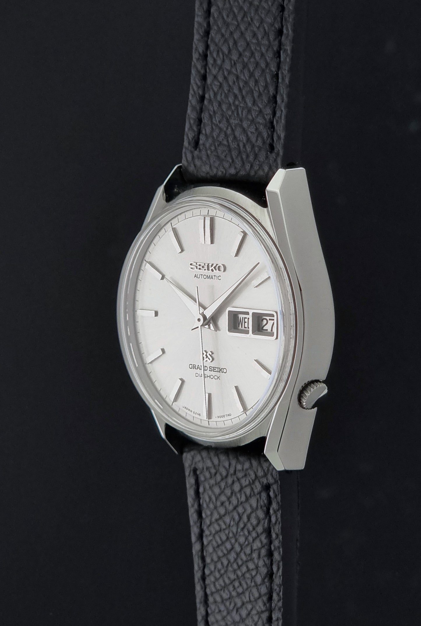 Vintage Grand Seiko 6246-9001 Wristwatch on a dark background crown profile view