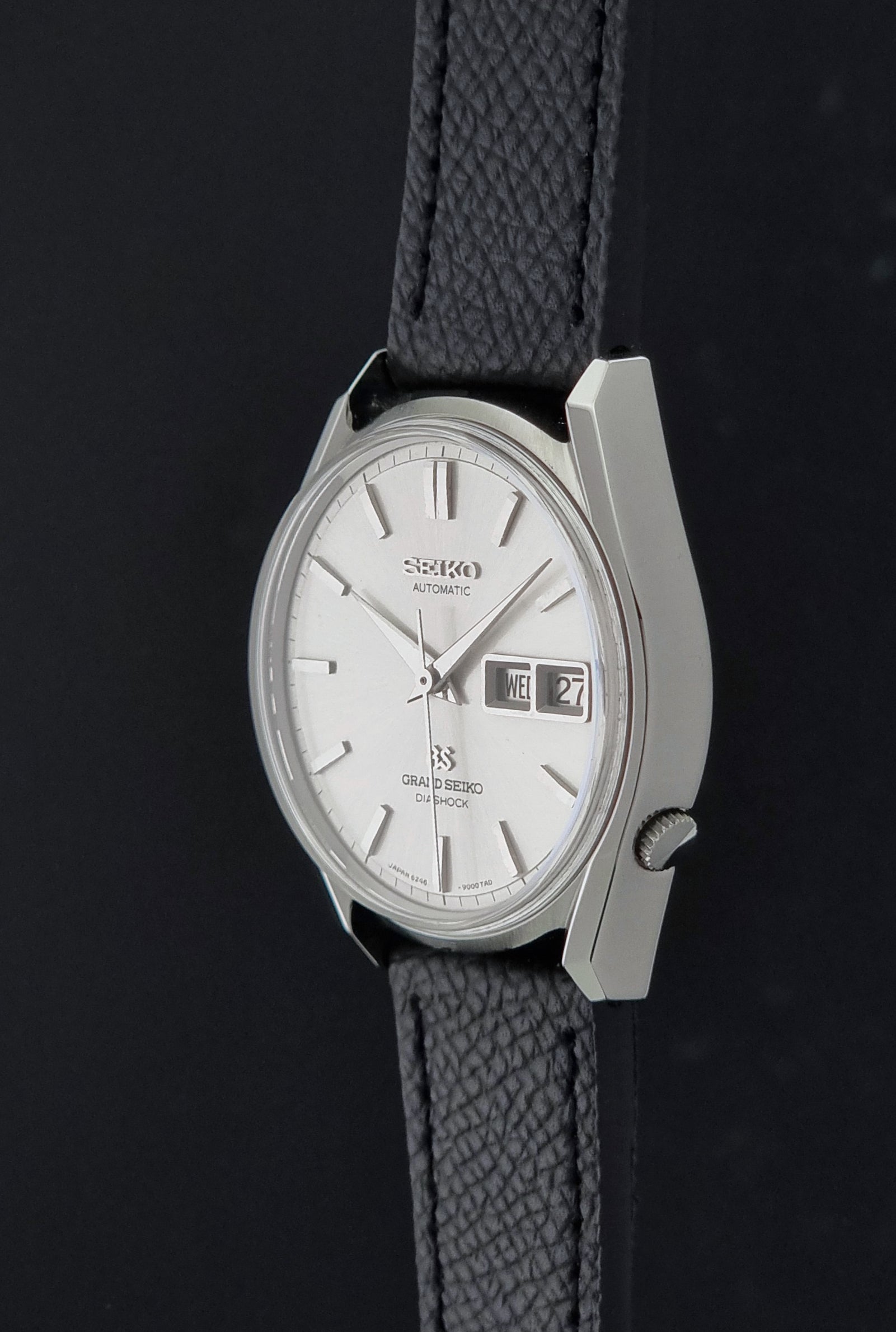 Vintage Grand Seiko 6246-9001 Wristwatch on a dark background crown profile view