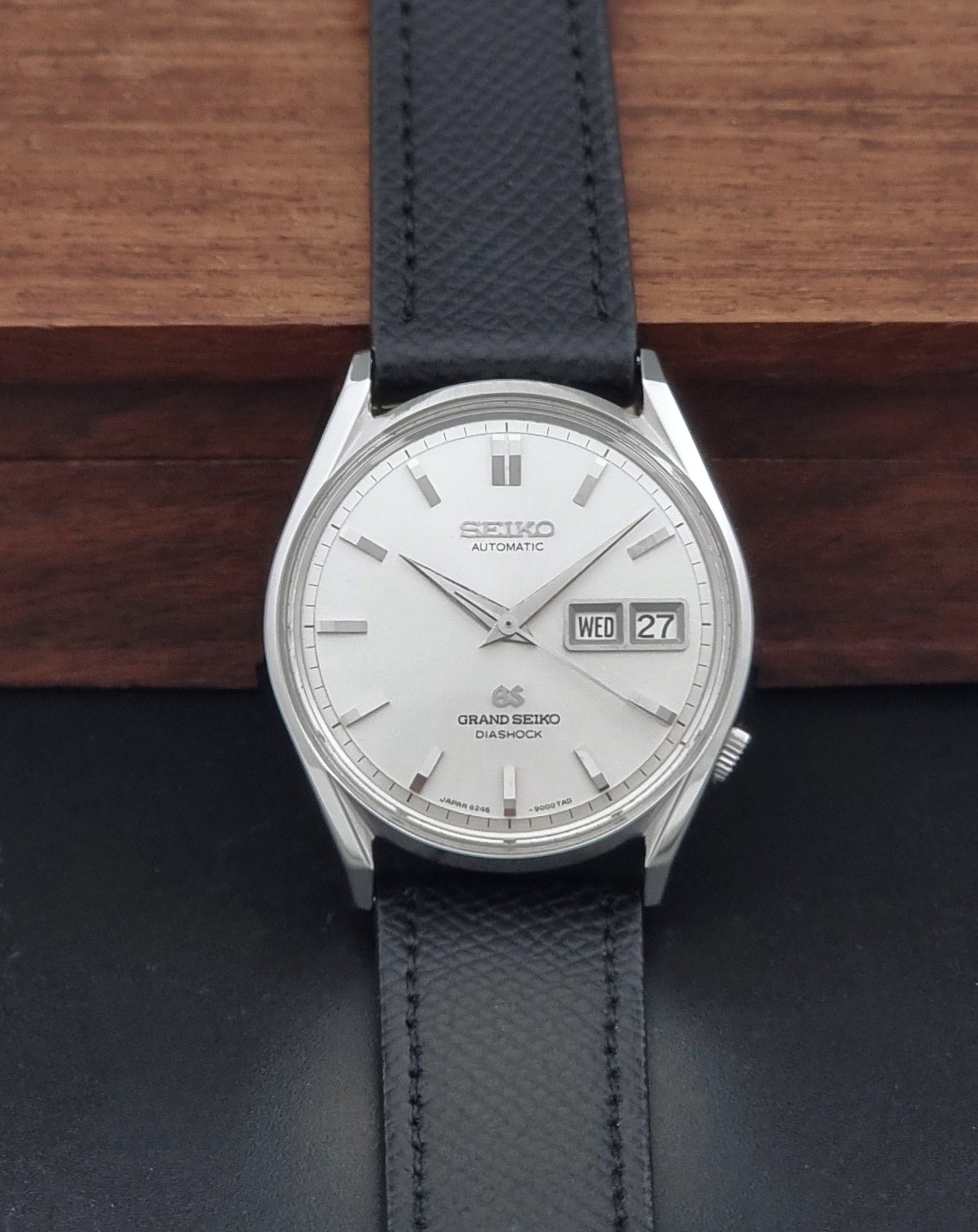 Vintage Grand Seiko 6246-9001 Wristwatch on a dark background dial view