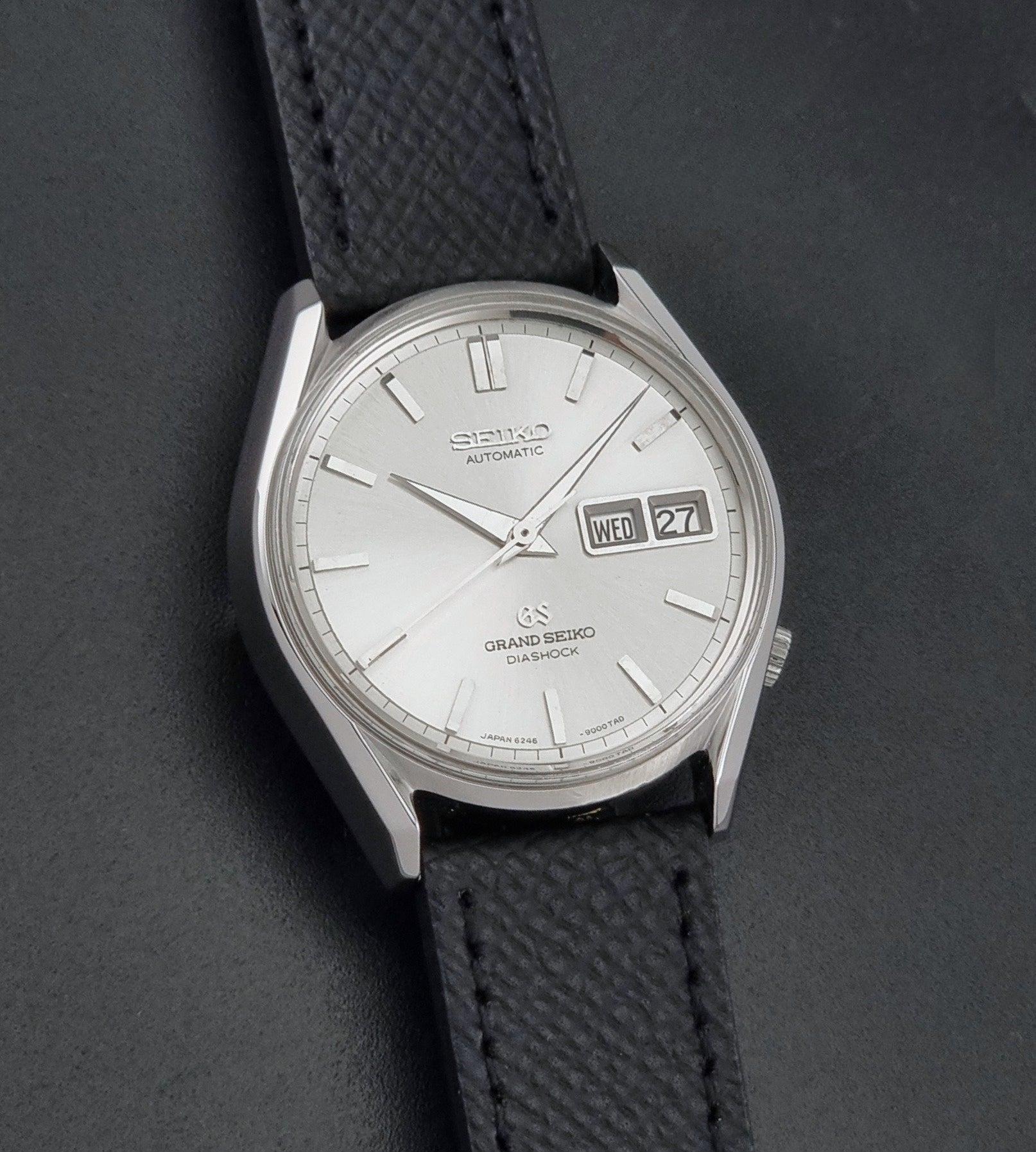 Vintage Grand Seiko 6246-9001 Wristwatch on a dark background front view
