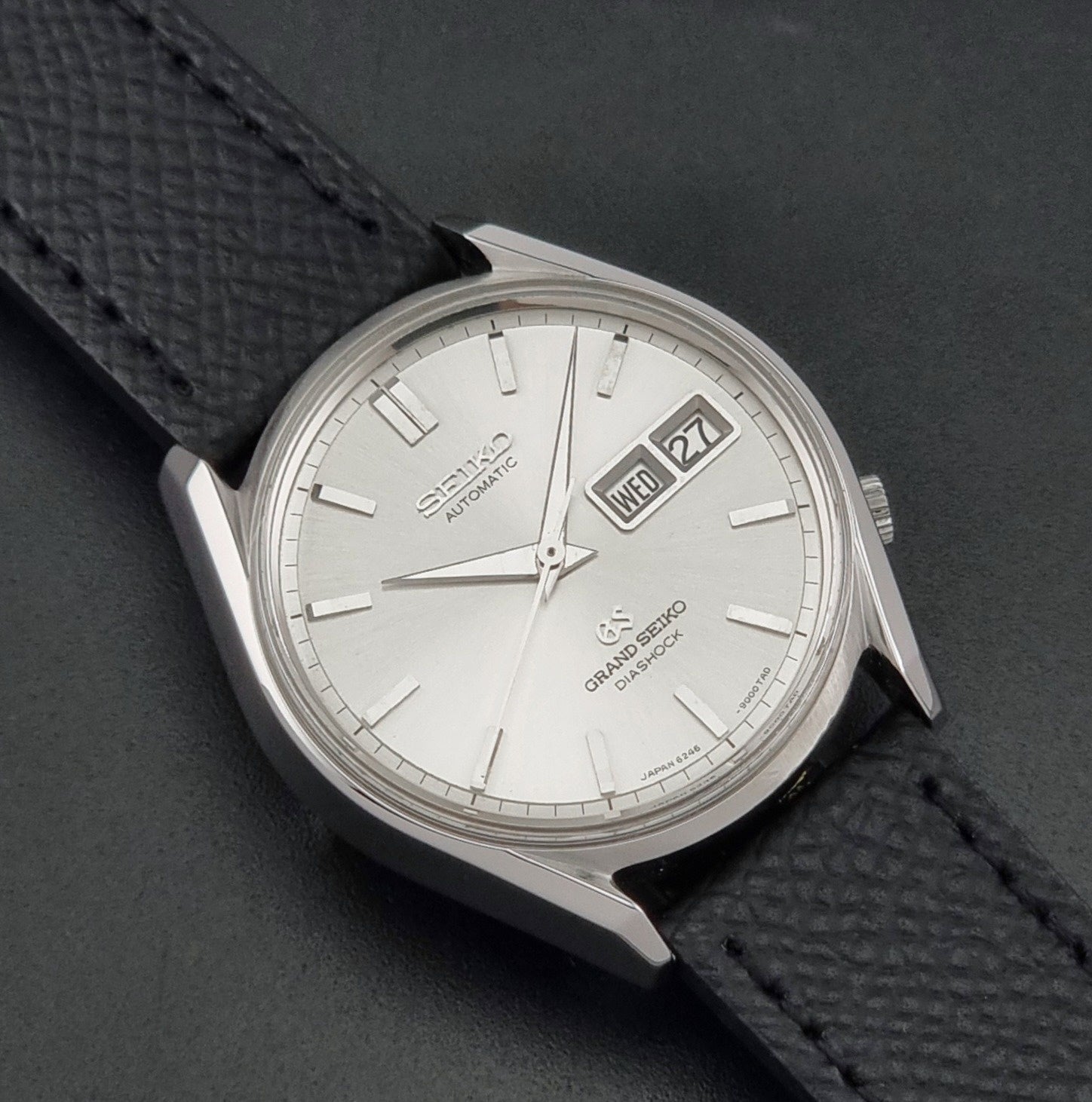 Vintage Grand Seiko 6246-9001 Wristwatch on a dark background close up dial view