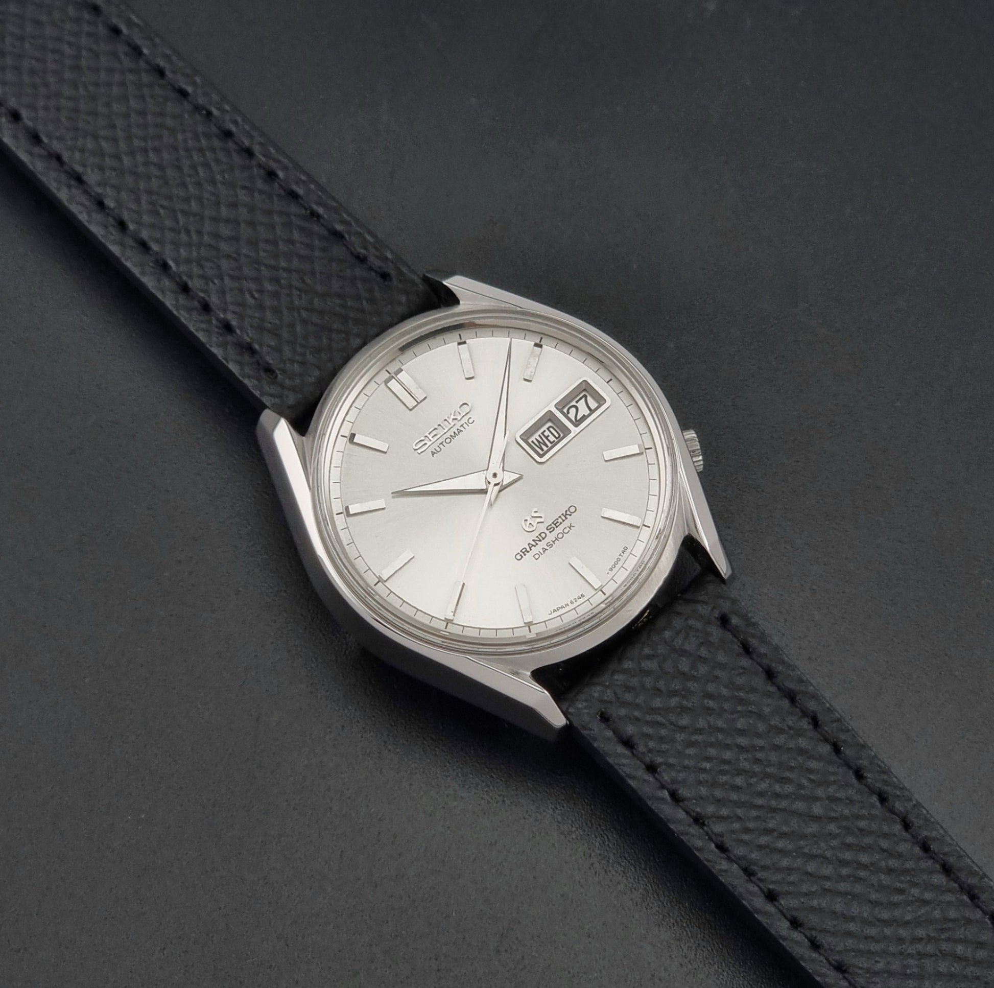 Vintage Grand Seiko 6246-9001 Wristwatch on a dark background dial