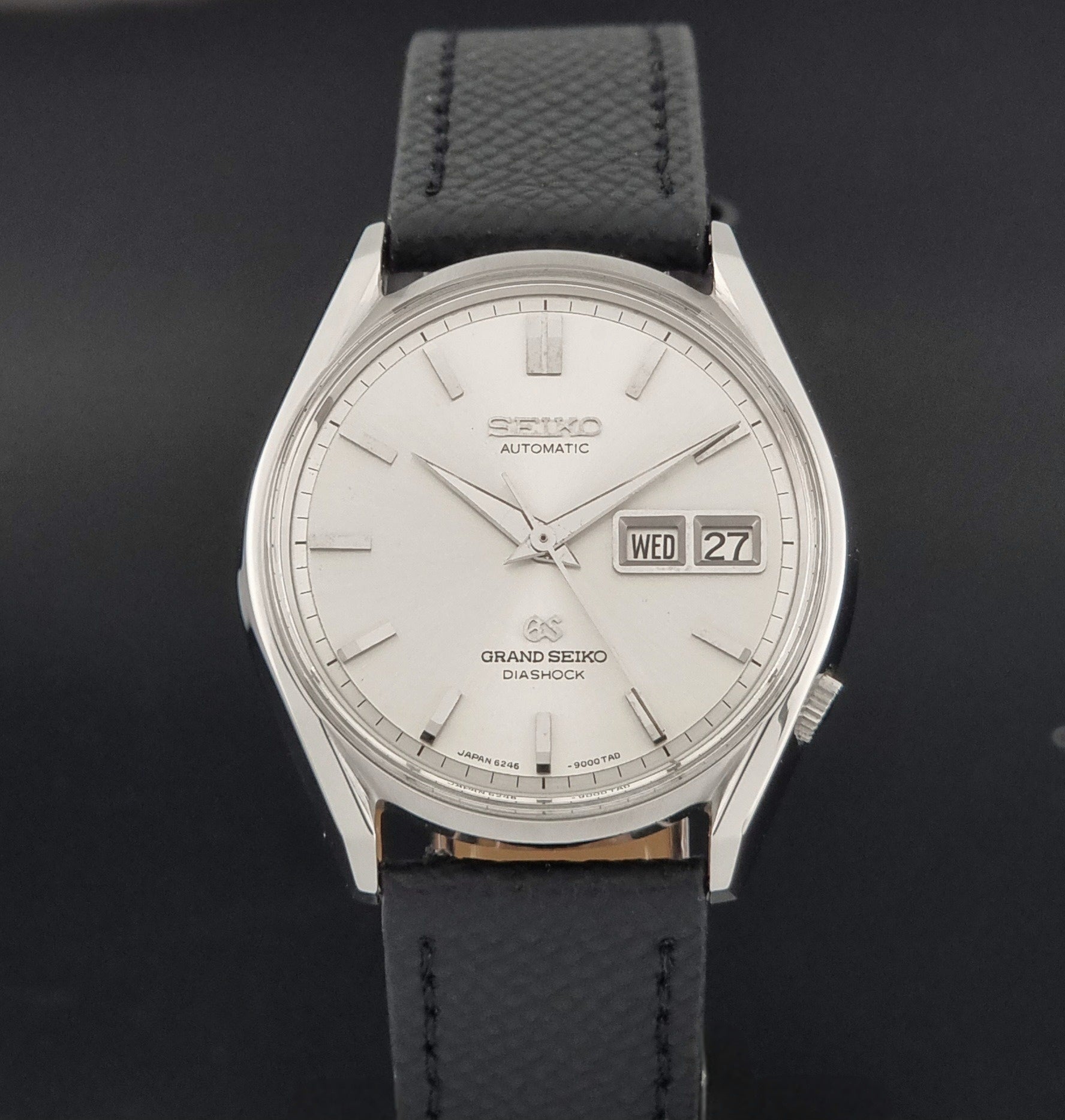 Vintage Grand Seiko 6246-9001 Wristwatch on a dark background close dial view