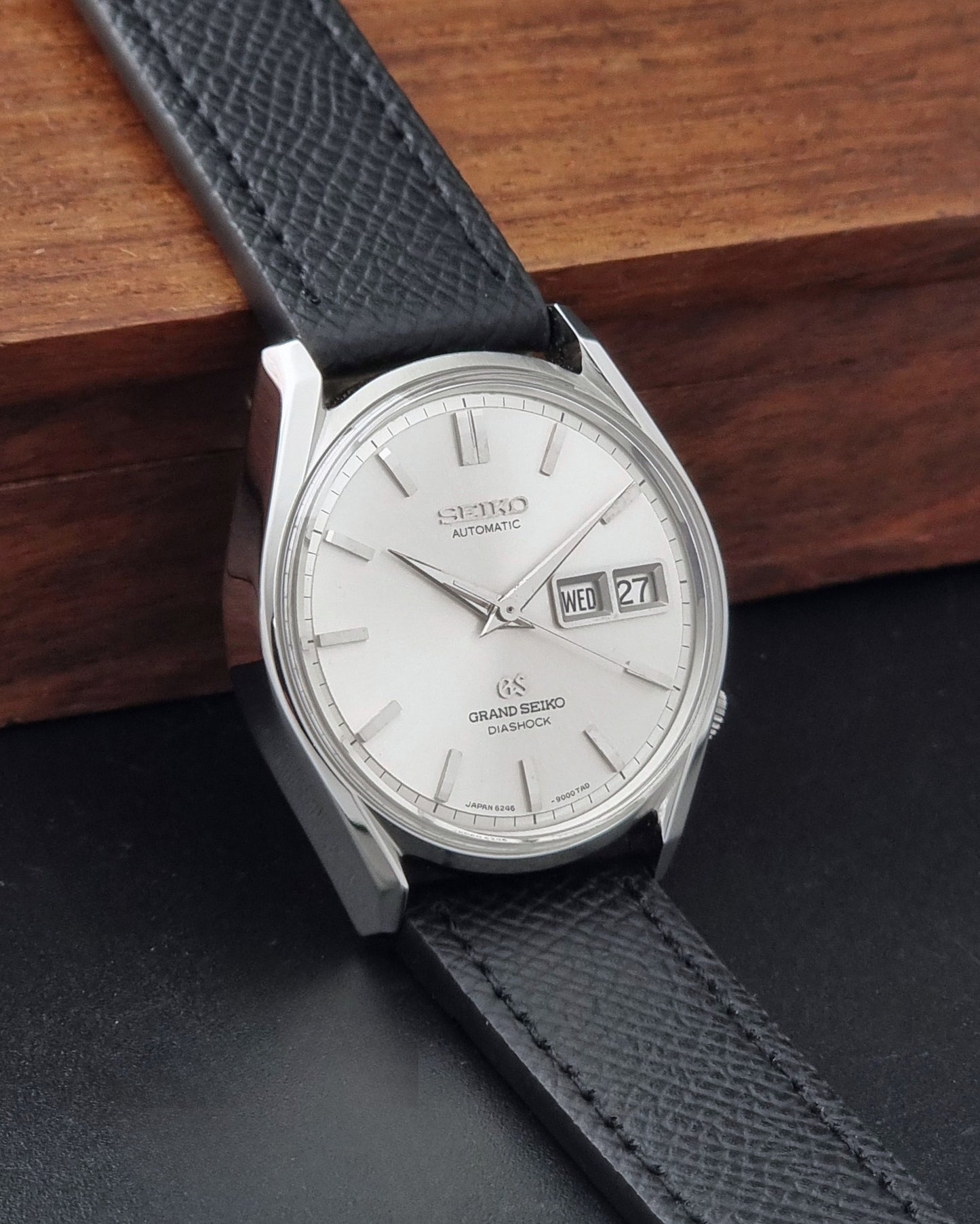 Vintage Grand Seiko 6246-9001 Wristwatch on a dark background side view