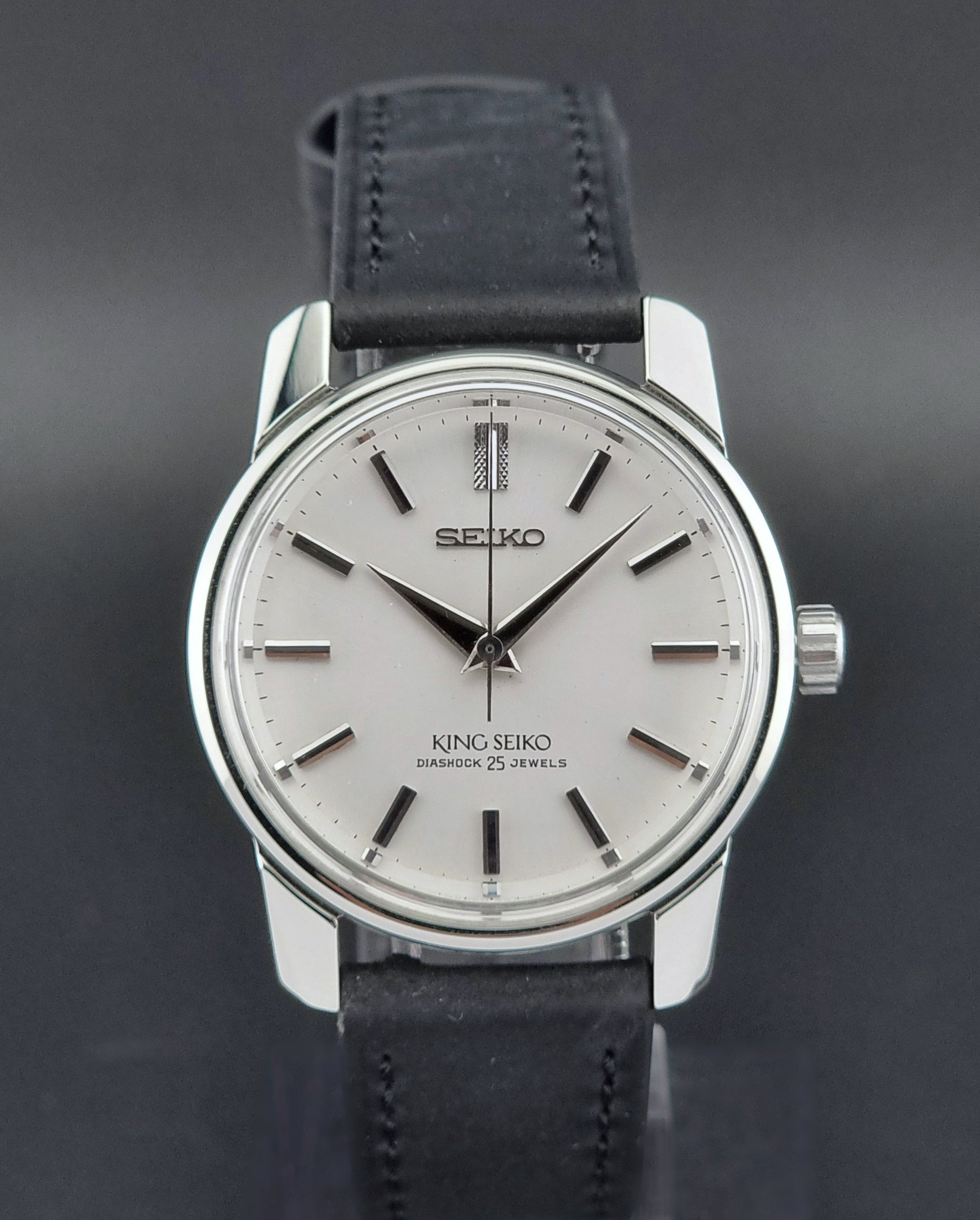 Vintage King Seiko 44-999 Watch with black leather strap on a dark background