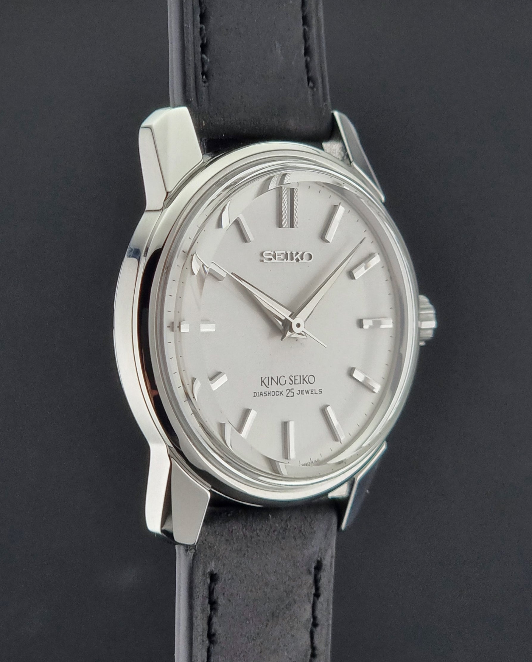 Vintage King Seiko 44-999 Watch with black leather strap on a dark background