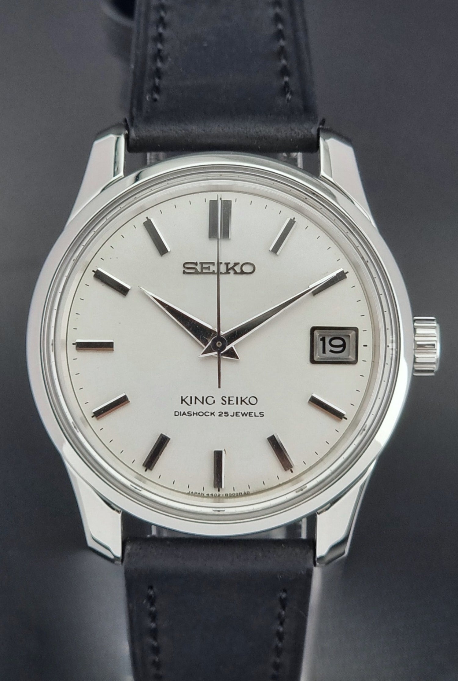 Vintage King Seiko 4402-8000  watch with black leather strap on a dark background