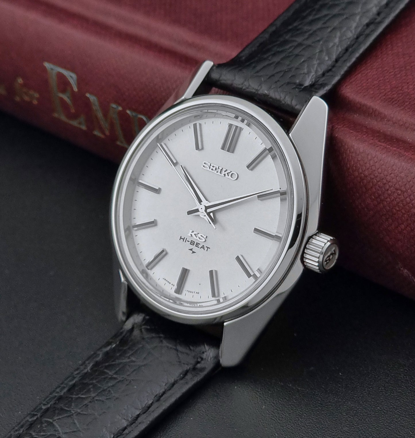 King Seiko 45-7001 watch with black leather strap on a dark surface