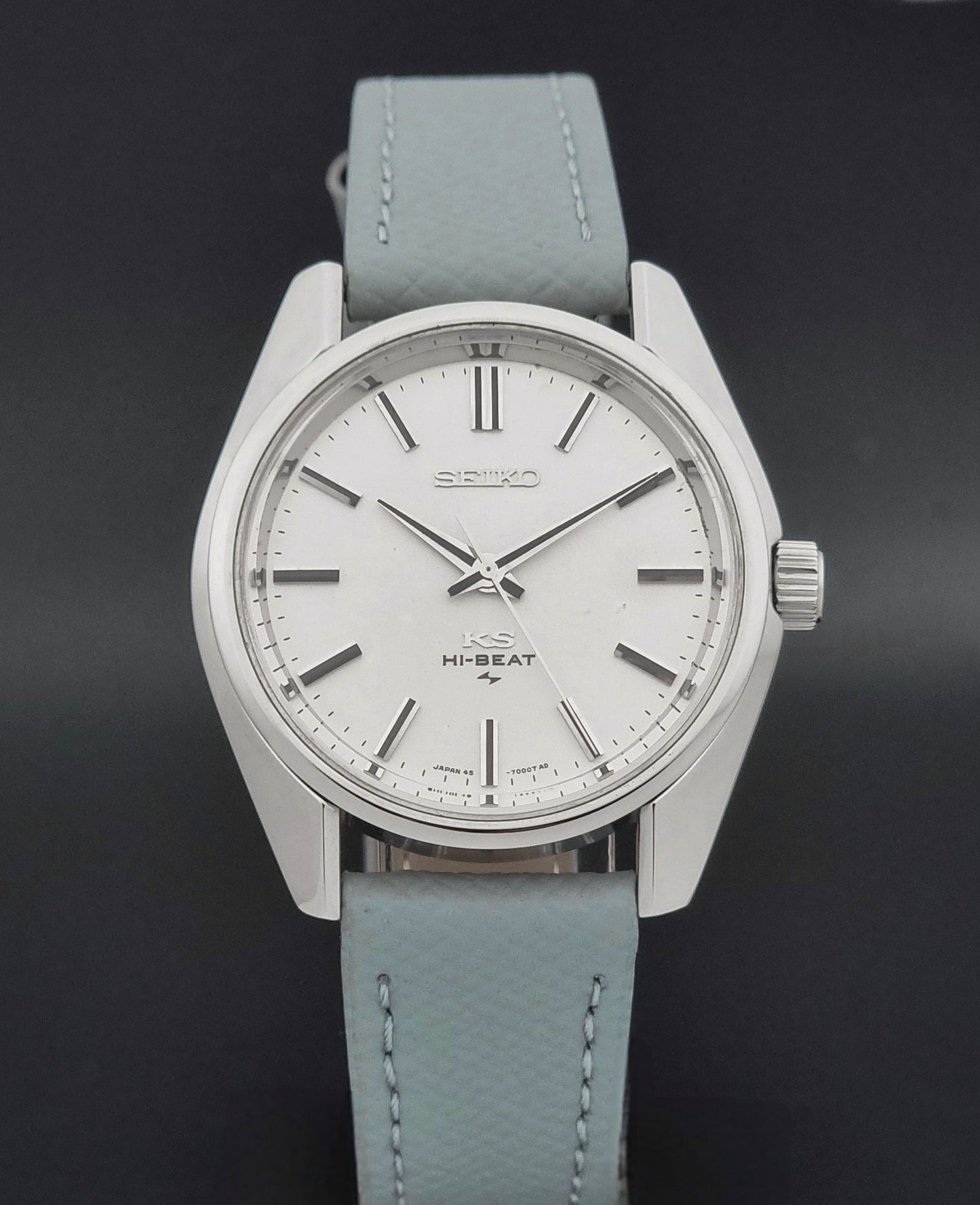 Vintage King Seiko 45-7001 watch with a grey leather strap on a brown background close dial view