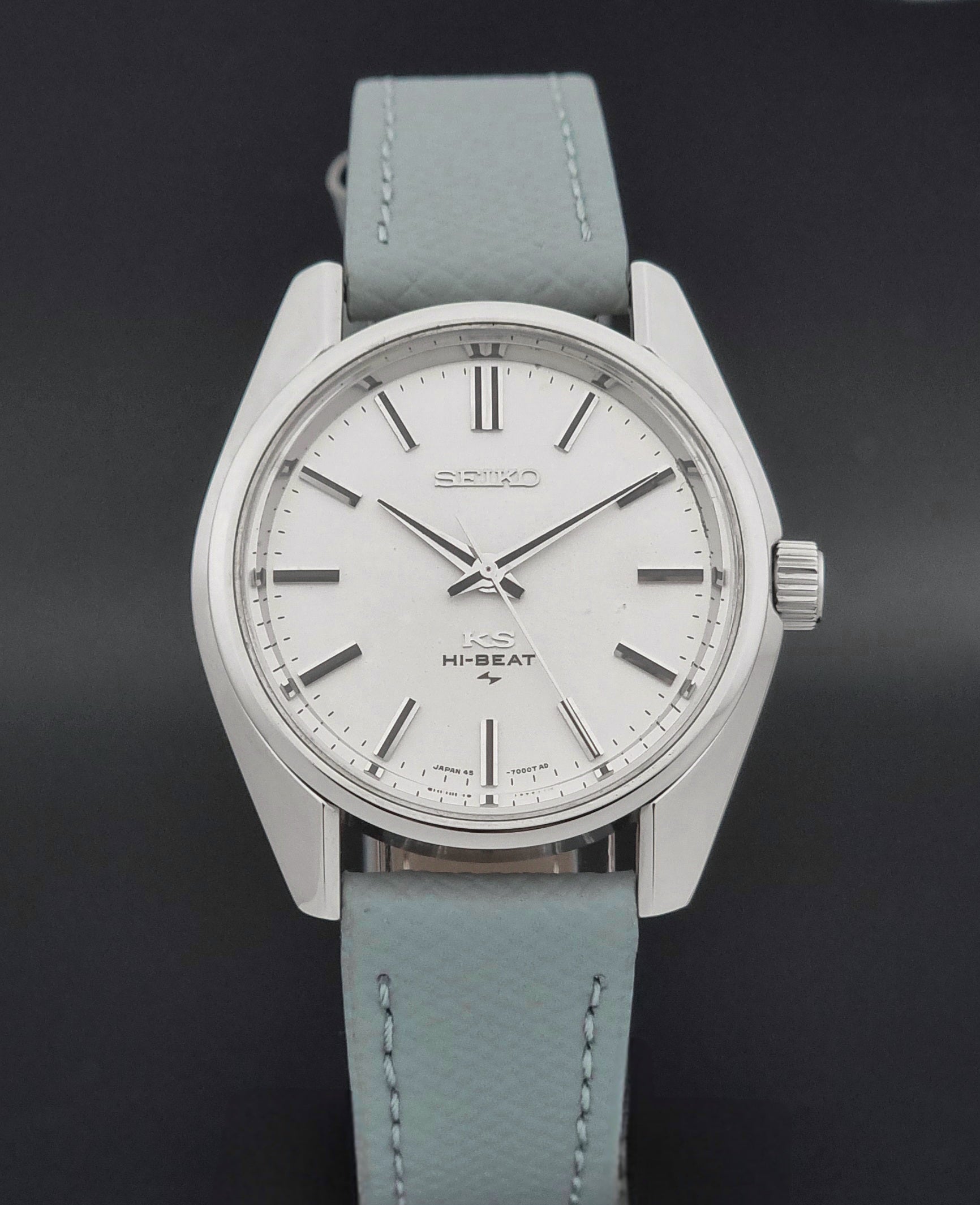 Vintage King Seiko 45-7001 watch with a grey leather strap on a brown background close dial view
