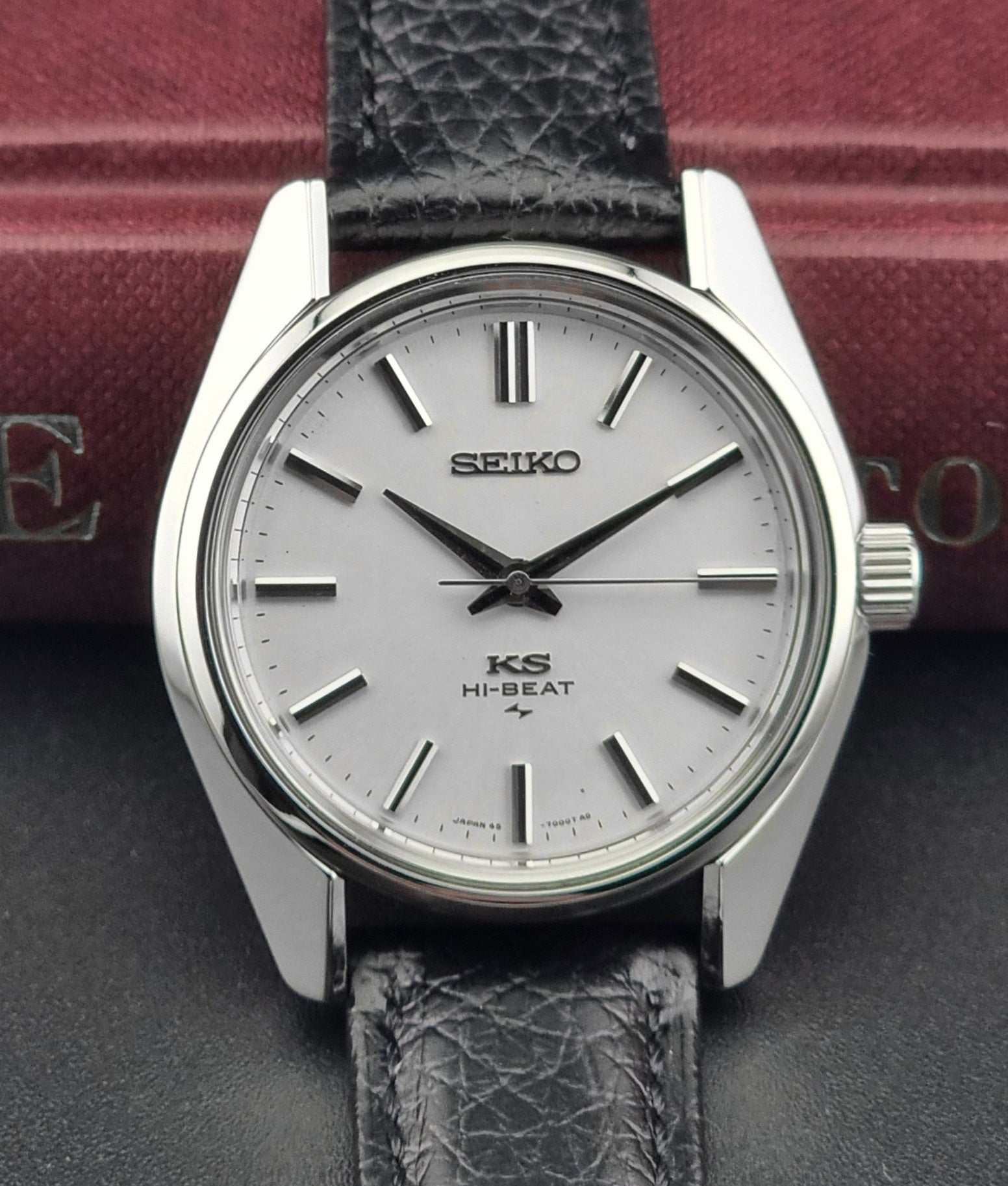 King Seiko 45-7001 watch with a black leather strap on a dark surface